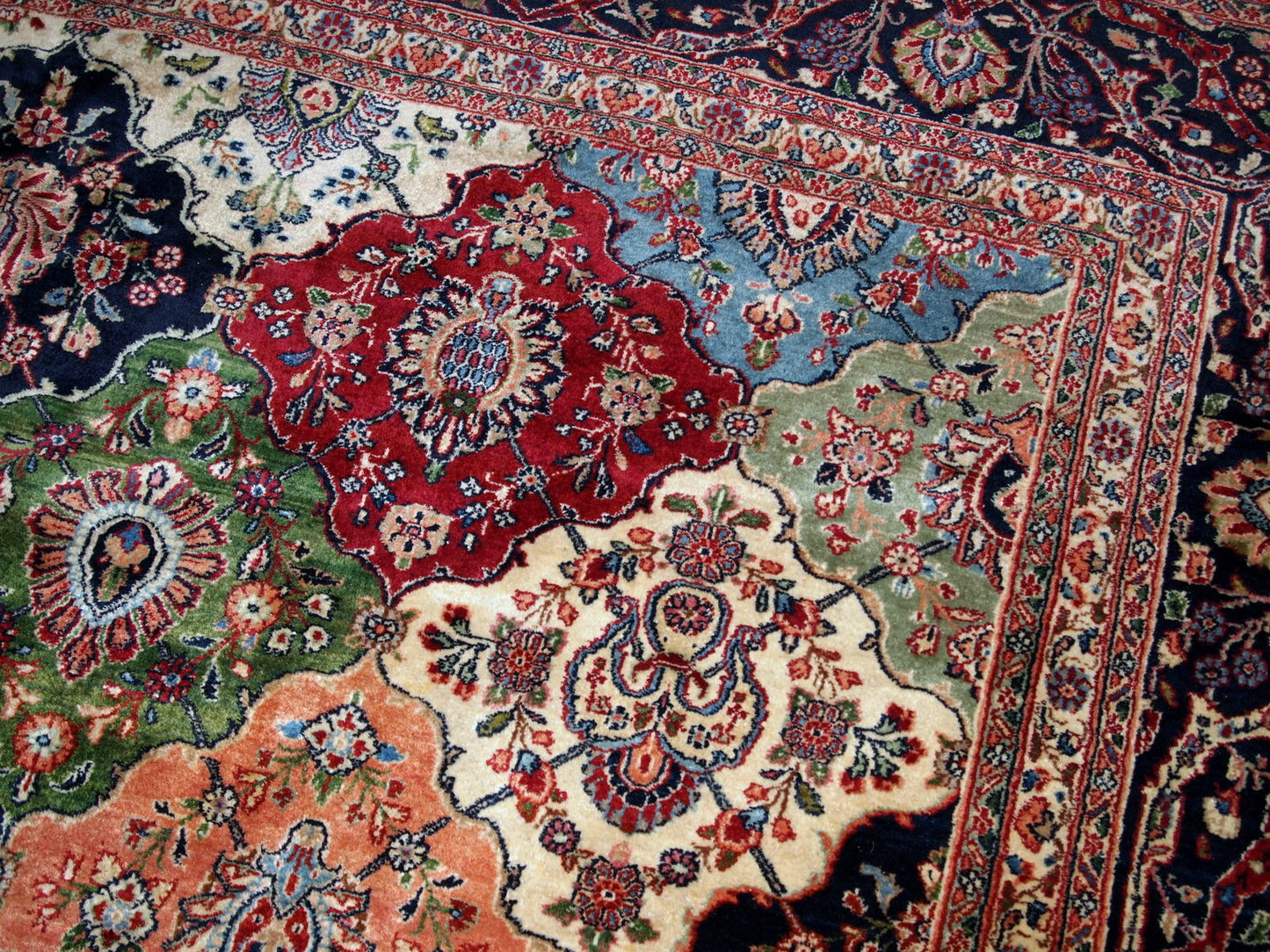 Antique Persian Kashan rug in colourful shades. The rug is in good condition, made in the beginning of 20th century.