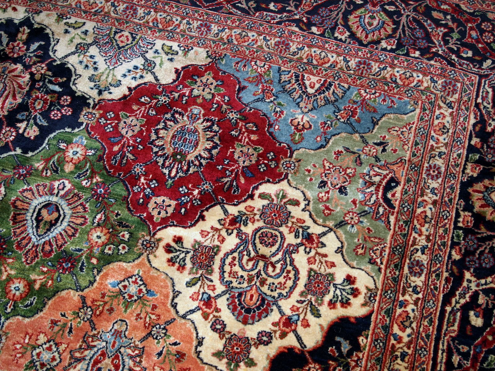 Antique Persian Kashan rug in colourful shades. The rug is in good condition, made in the beginning of 20th century.