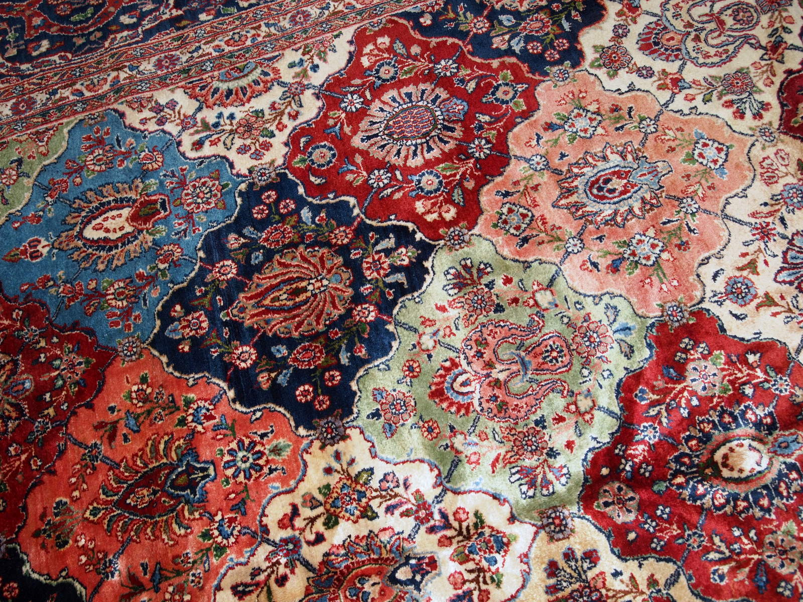Antique Persian Kashan rug in colourful shades. The rug is in good condition, made in the beginning of 20th century.