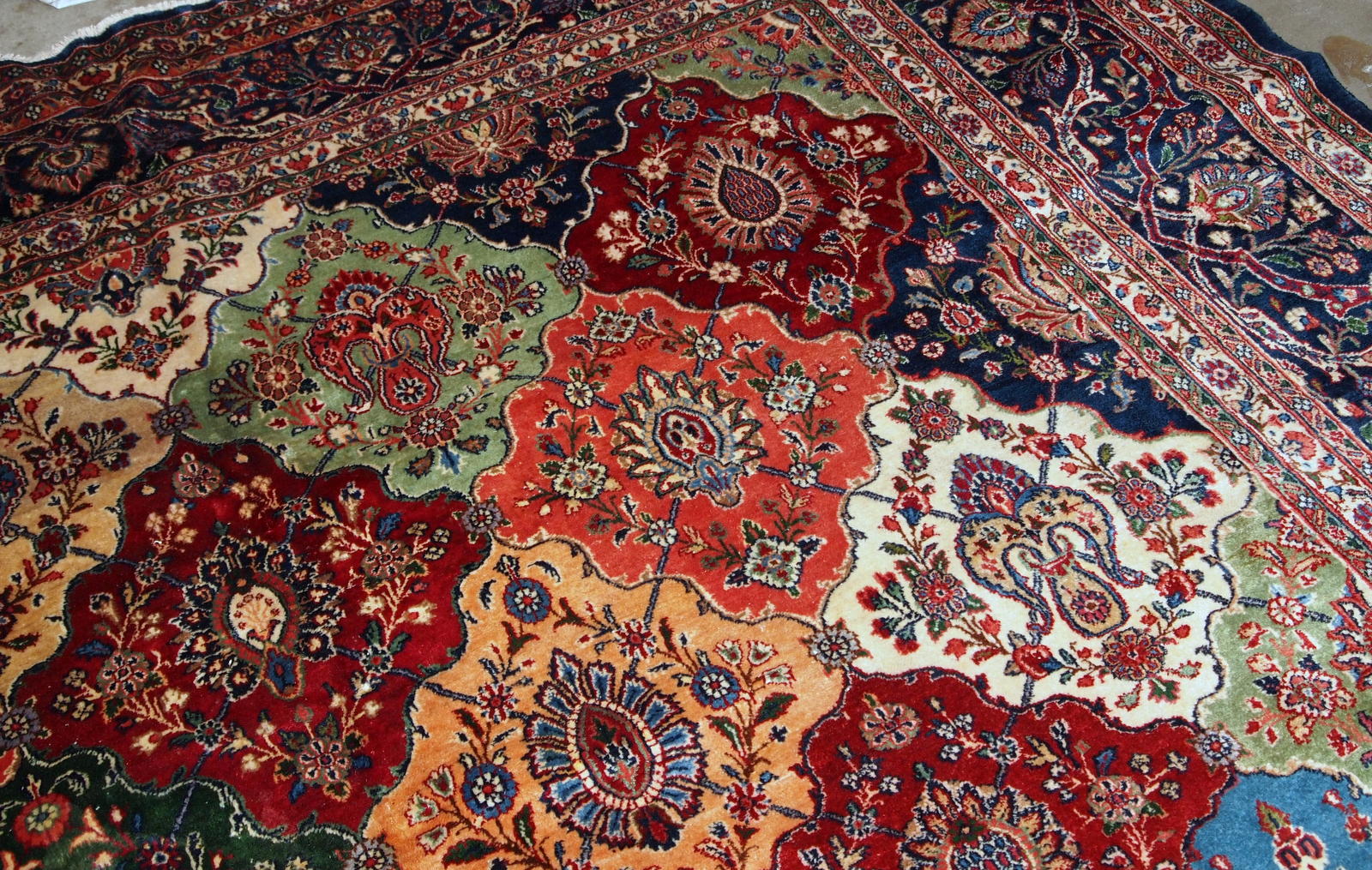 Antique Persian Kashan rug in colourful shades. The rug is in good condition, made in the beginning of 20th century.