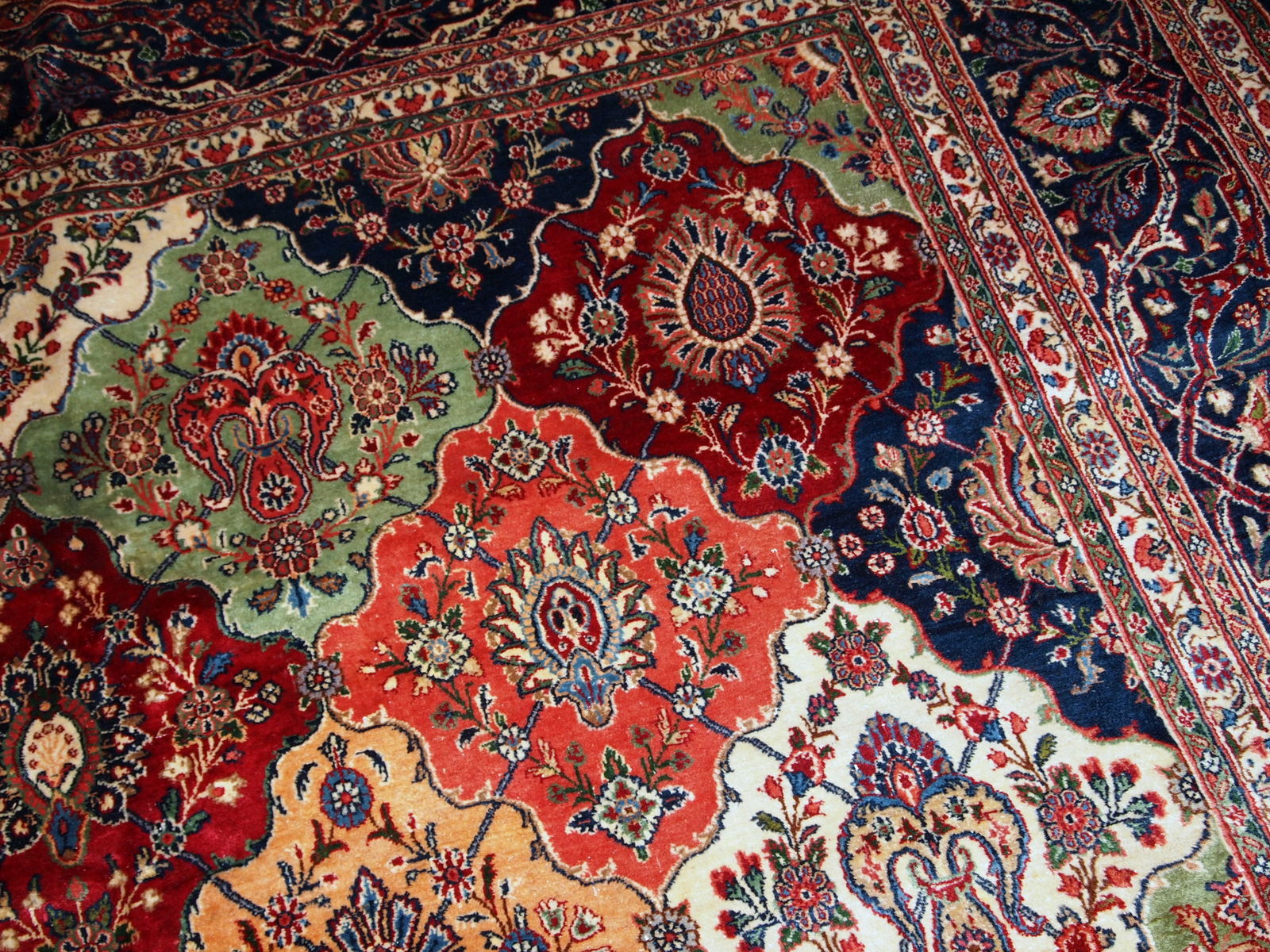 Antique Persian Kashan rug in colourful shades. The rug is in good condition, made in the beginning of 20th century.