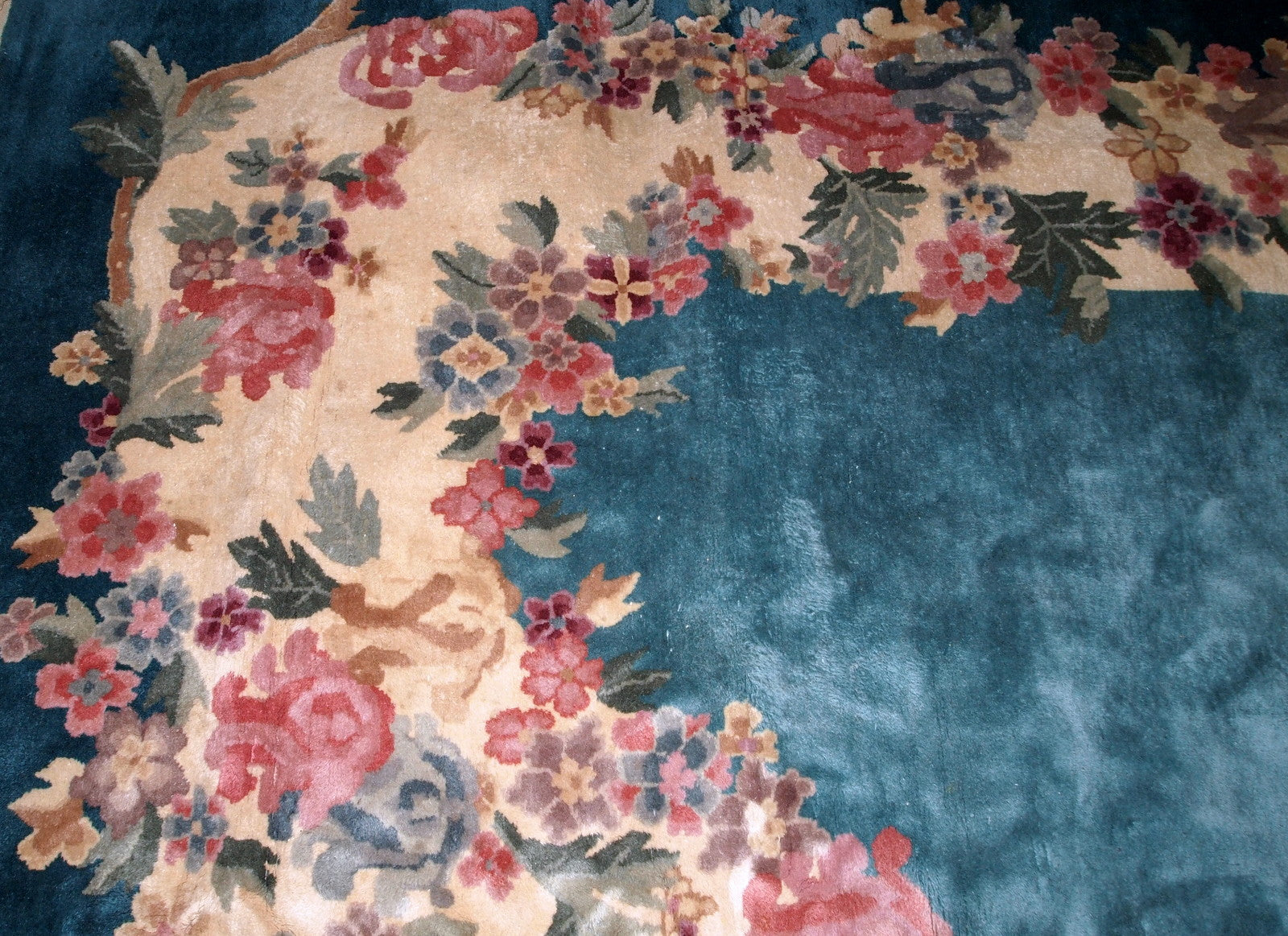 Handmade antique Art Deco Chinese rug in turquoise color. The rug decorated in Art Deco floral design. It is in original good condition.