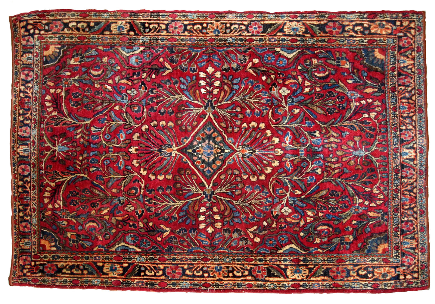 Handmade antique Sarouk rug in bright wool. It has been made in the beginning of 20th century in Middle East region.