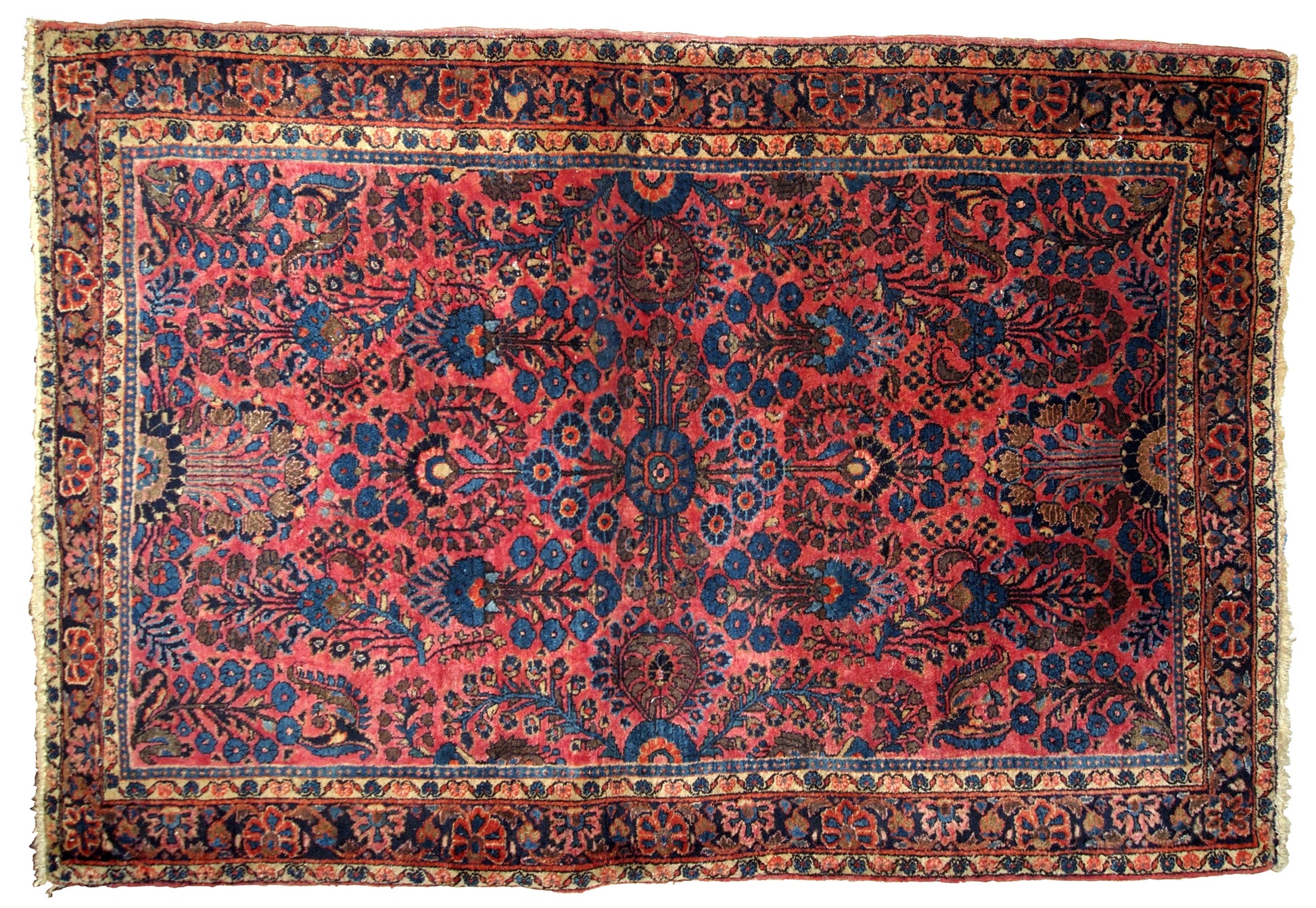 Handmade antique Sarouk rug in bright red and blue shades. The rug is in original good condition from the beginning of 20th century.