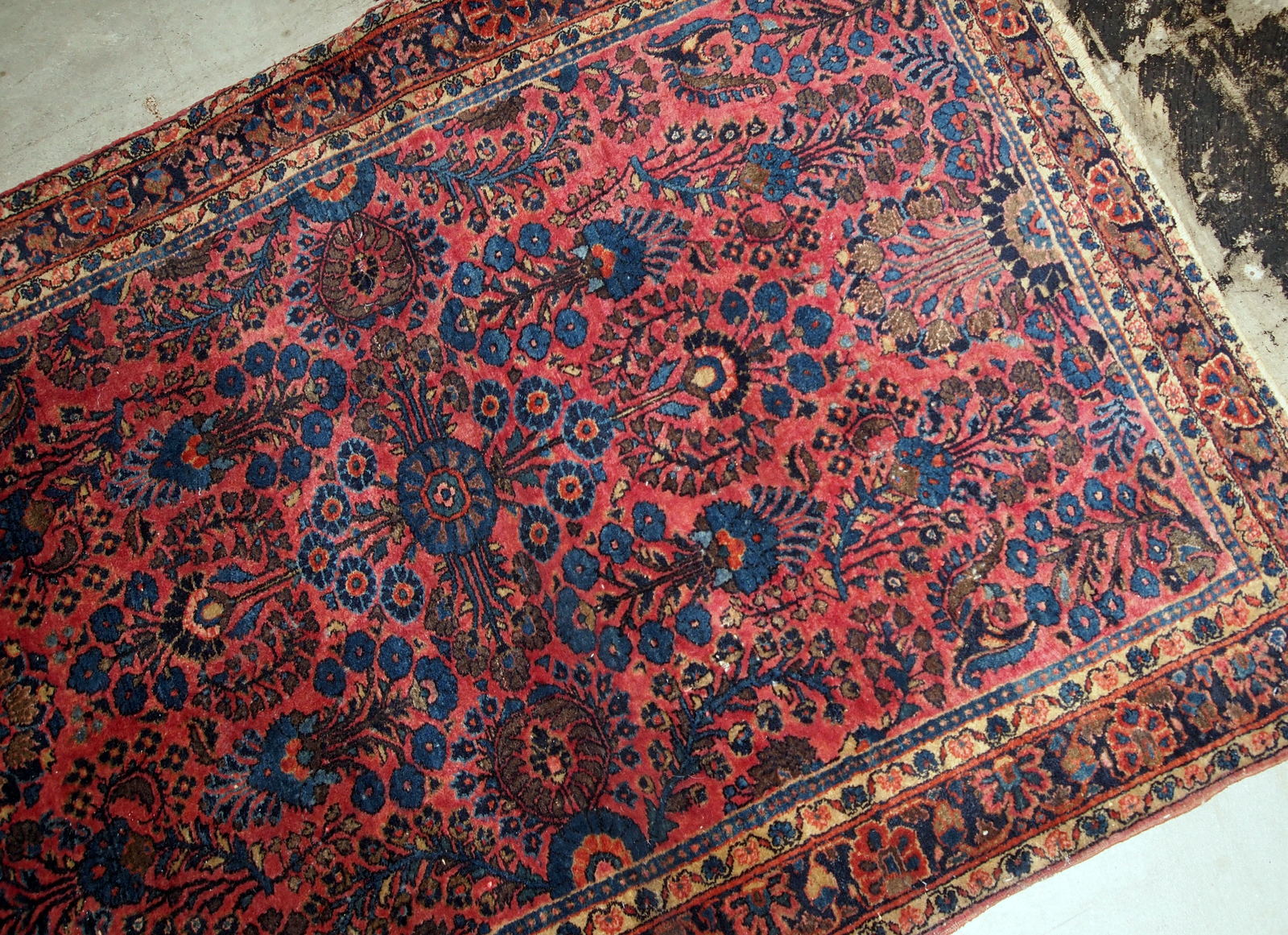 Handmade antique Sarouk rug in bright red and blue shades. The rug is in original good condition from the beginning of 20th century.