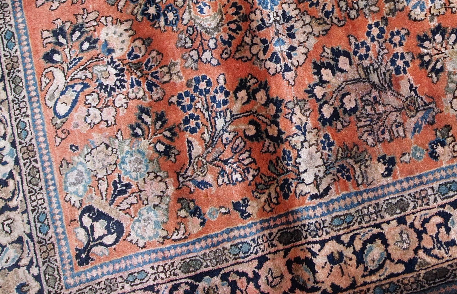 Hand-weaved antique Sarouk square rug from the beginning of 20th century. The rug is in original good condition, made in classic floral design in red and sky blue shades.