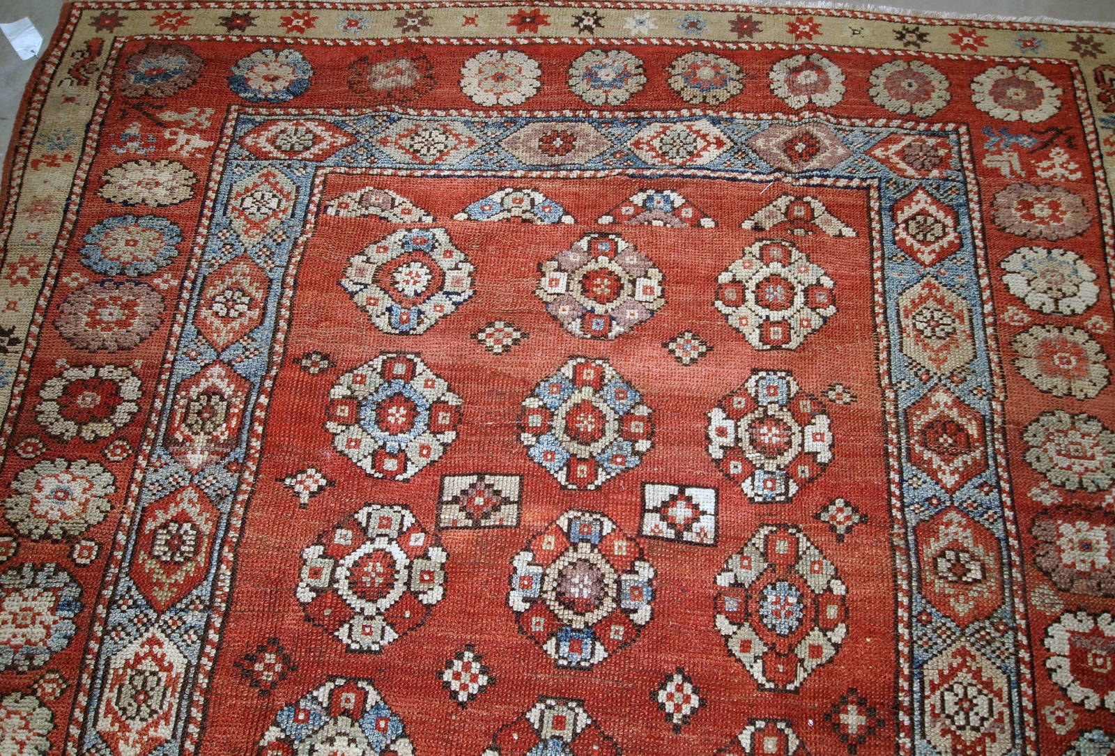 Handmade antique Turkish Melas rug in red, sky blue and beige shades. The rug is from the end of 19th century in original good condition.