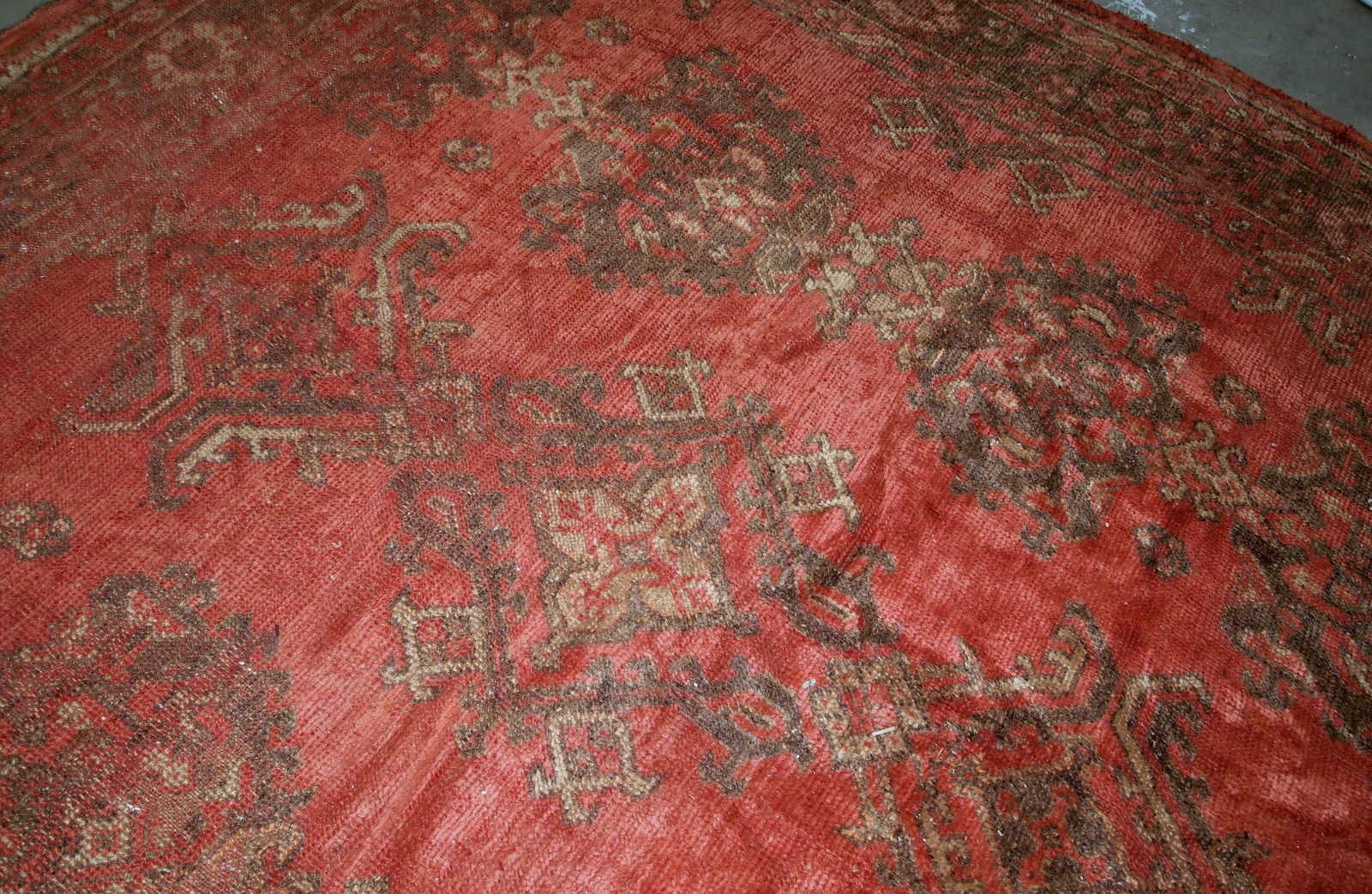 Antique handmade Turkish rug in orange color. The rug is from the beginning of 20th century in original condition, it has some signs of age.