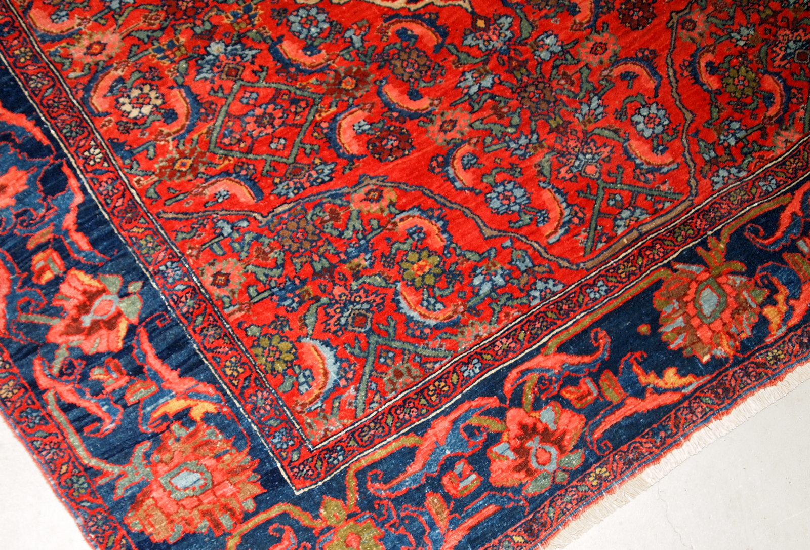 Handmade antique Bidjar rug from the beginning of 20th century. The rug is in original good condition made in bright red wool.