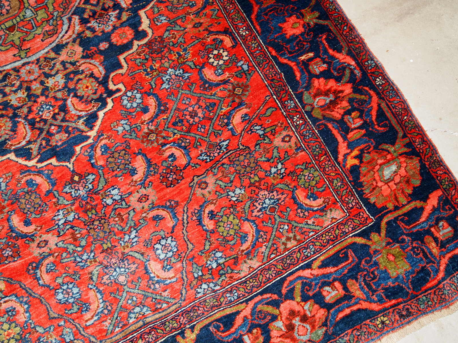 Handmade antique Bidjar rug from the beginning of 20th century. The rug is in original good condition made in bright red wool.