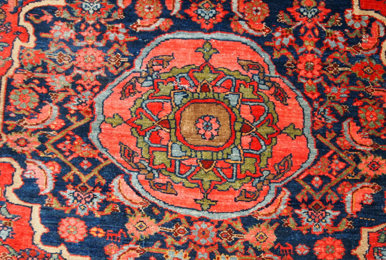 Handmade antique Bidjar rug from the beginning of 20th century. The rug is in original good condition made in bright red wool.