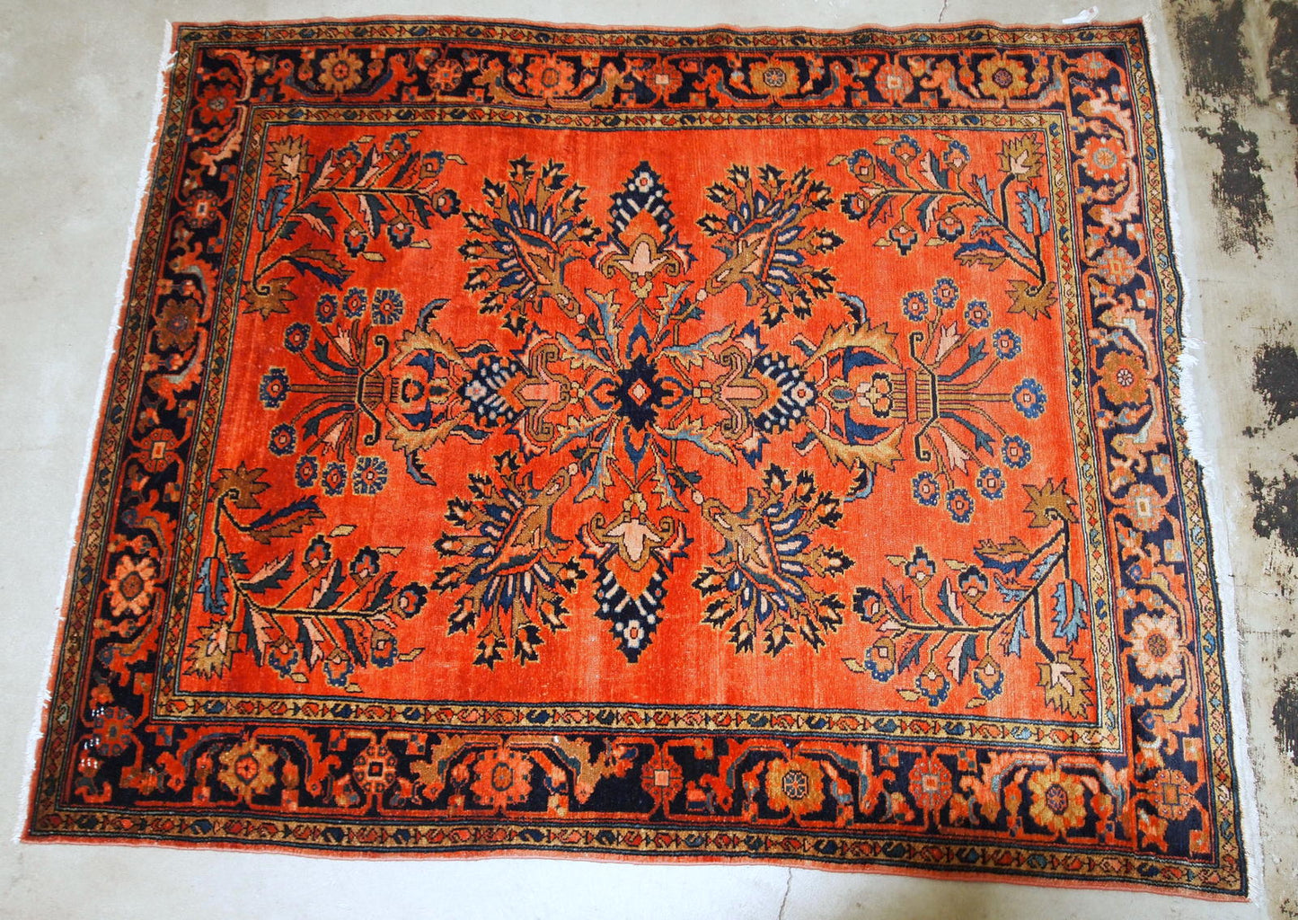 Antique hand woven Lilihan rug in red colour. The rug is from the beginning of 20th century in original condition, has a little damage on one end.