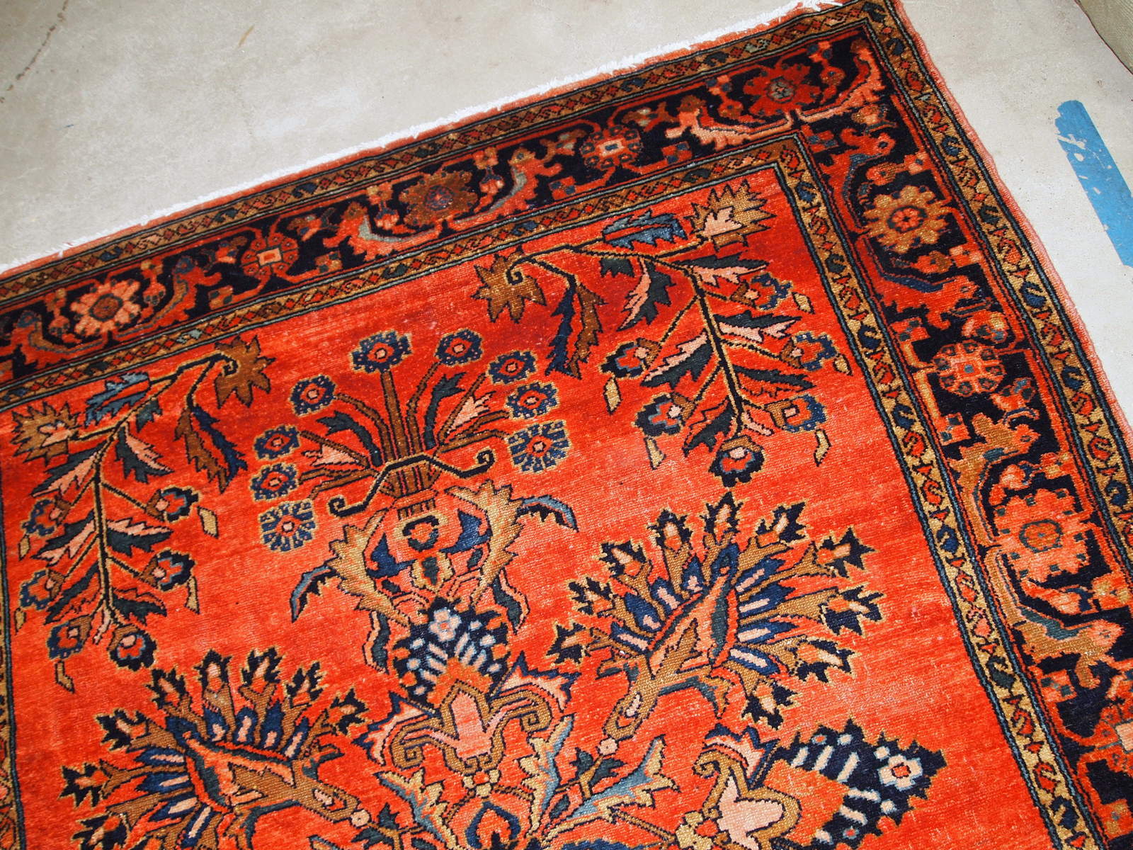 Antique hand woven Lilihan rug in red colour. The rug is from the beginning of 20th century in original condition, has a little damage on one end.