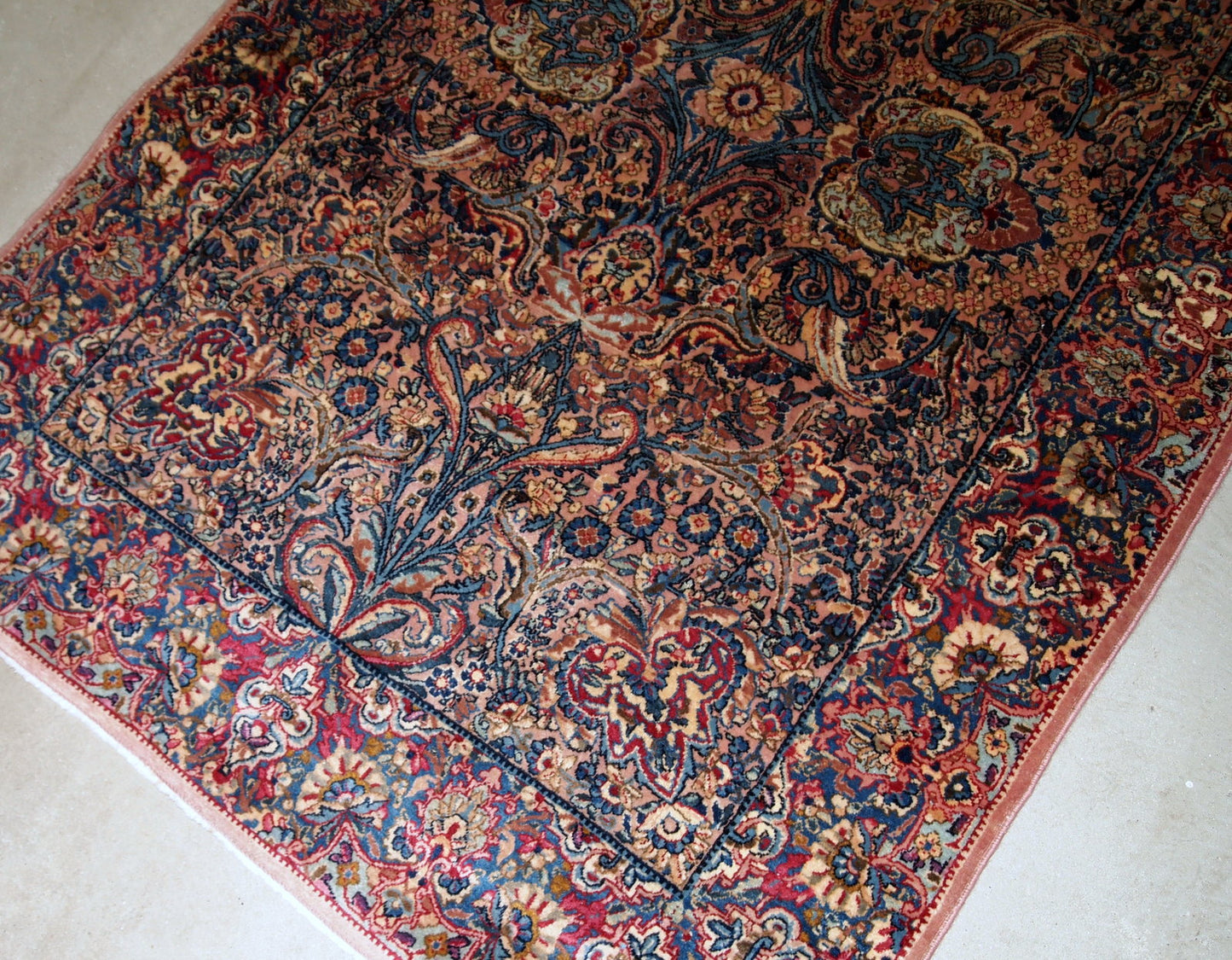 Hand made antique Persian Kerman rug in original good condition. The rug made in the beginning of 20th century in wool.