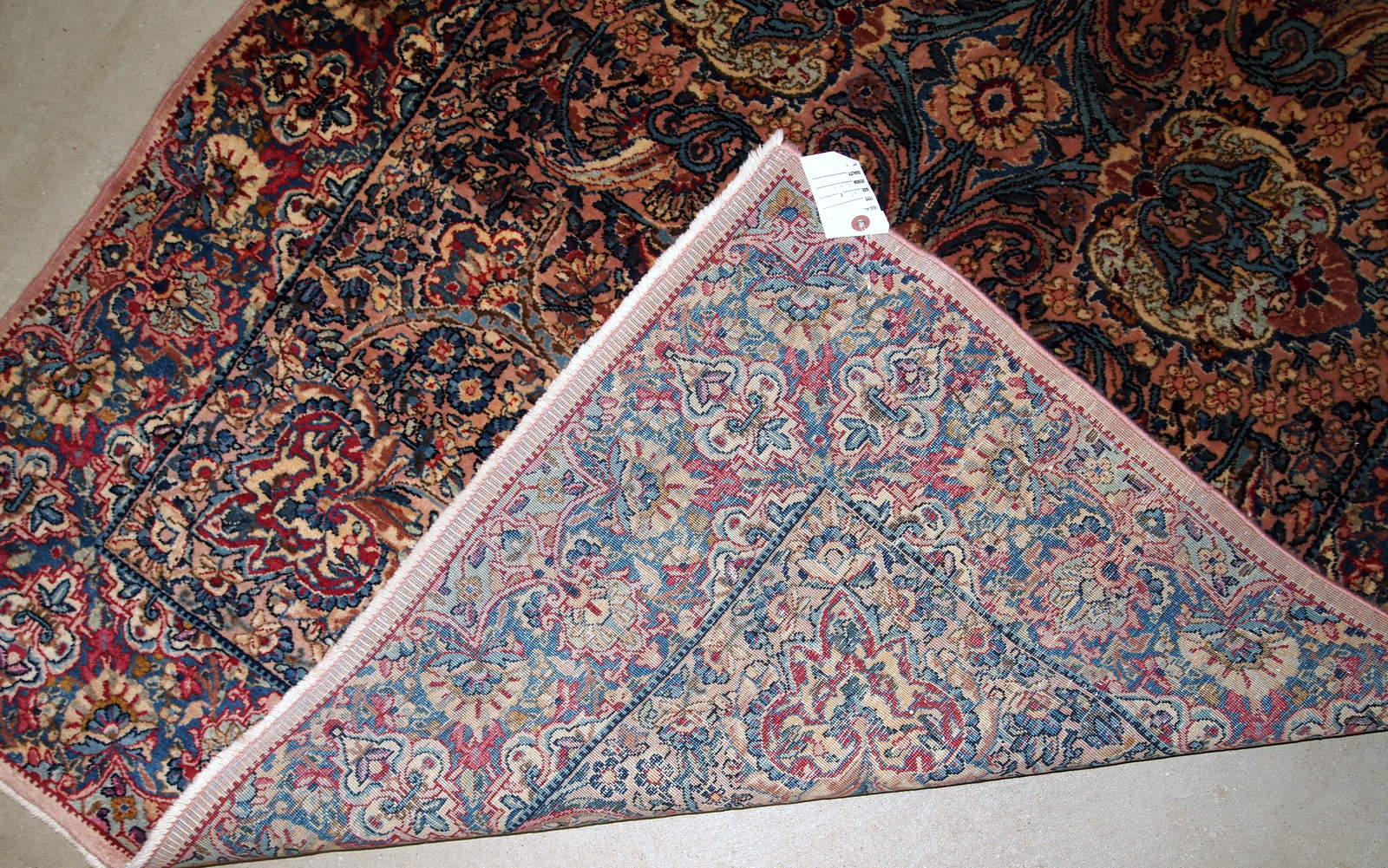 Hand made antique Persian Kerman rug in original good condition. The rug made in the beginning of 20th century in wool.