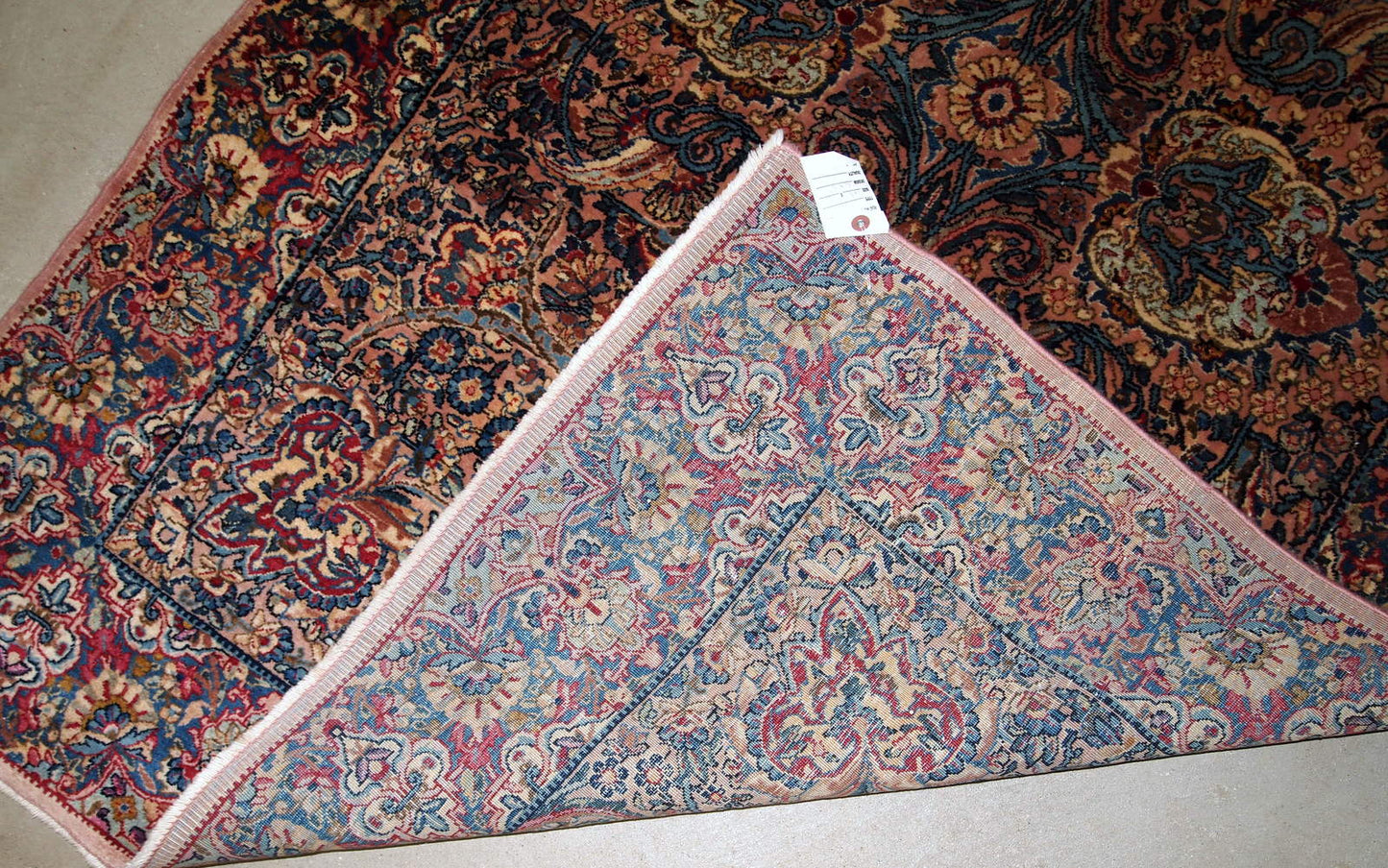 Hand made antique Persian Kerman rug in original good condition. The rug made in the beginning of 20th century in wool.