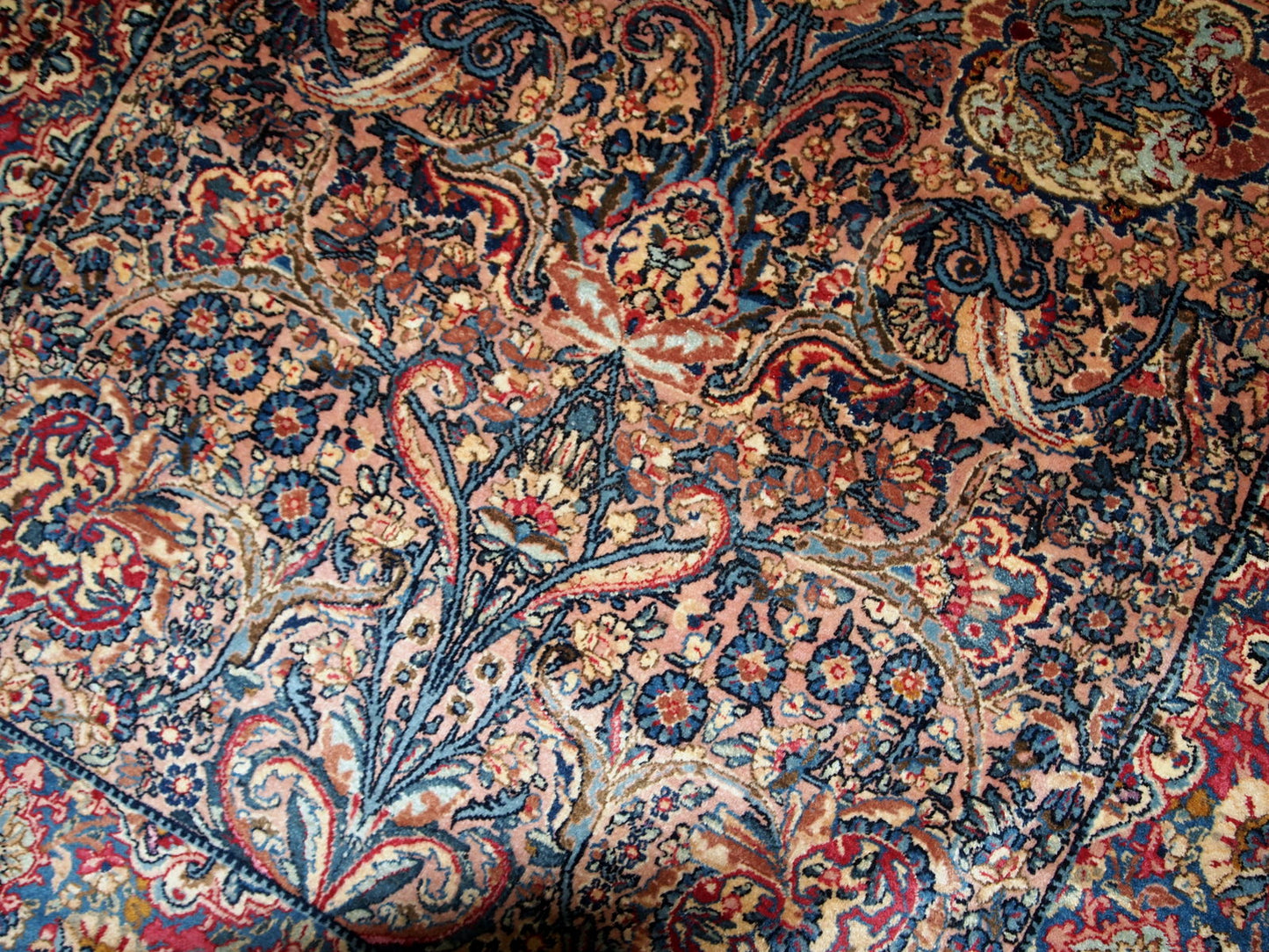 Hand made antique Persian Kerman rug in original good condition. The rug made in the beginning of 20th century in wool.