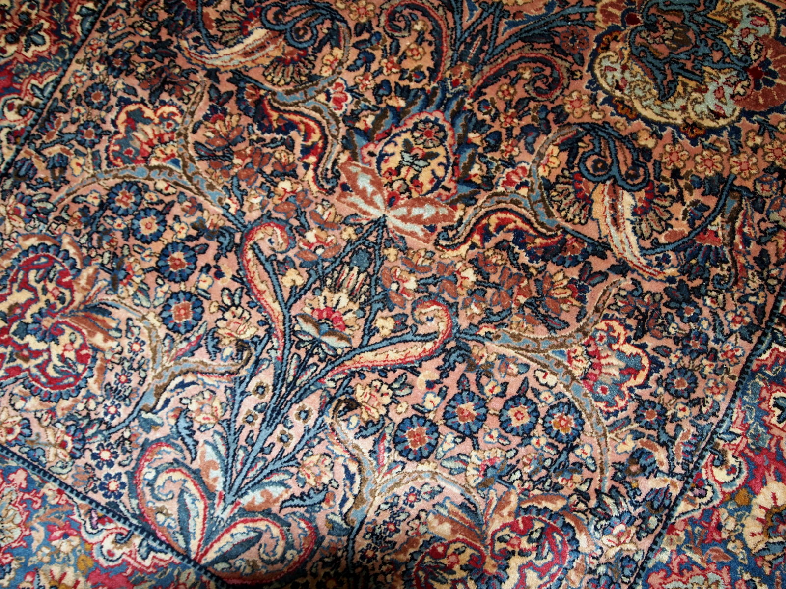 Hand made antique Persian Kerman rug in original good condition. The rug made in the beginning of 20th century in wool.