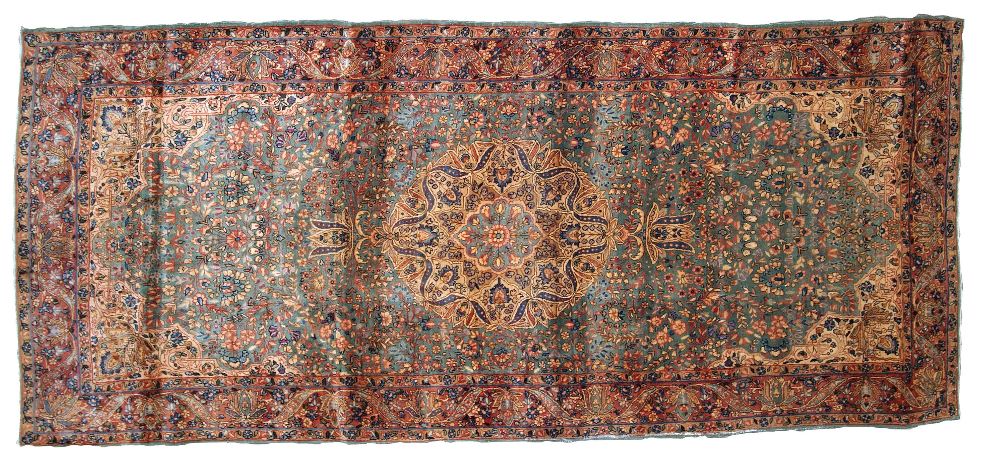 Handmade antique Kerman rug in original good condition. The rug has been made in the beginning of 20th century in  sea green/blue wool.