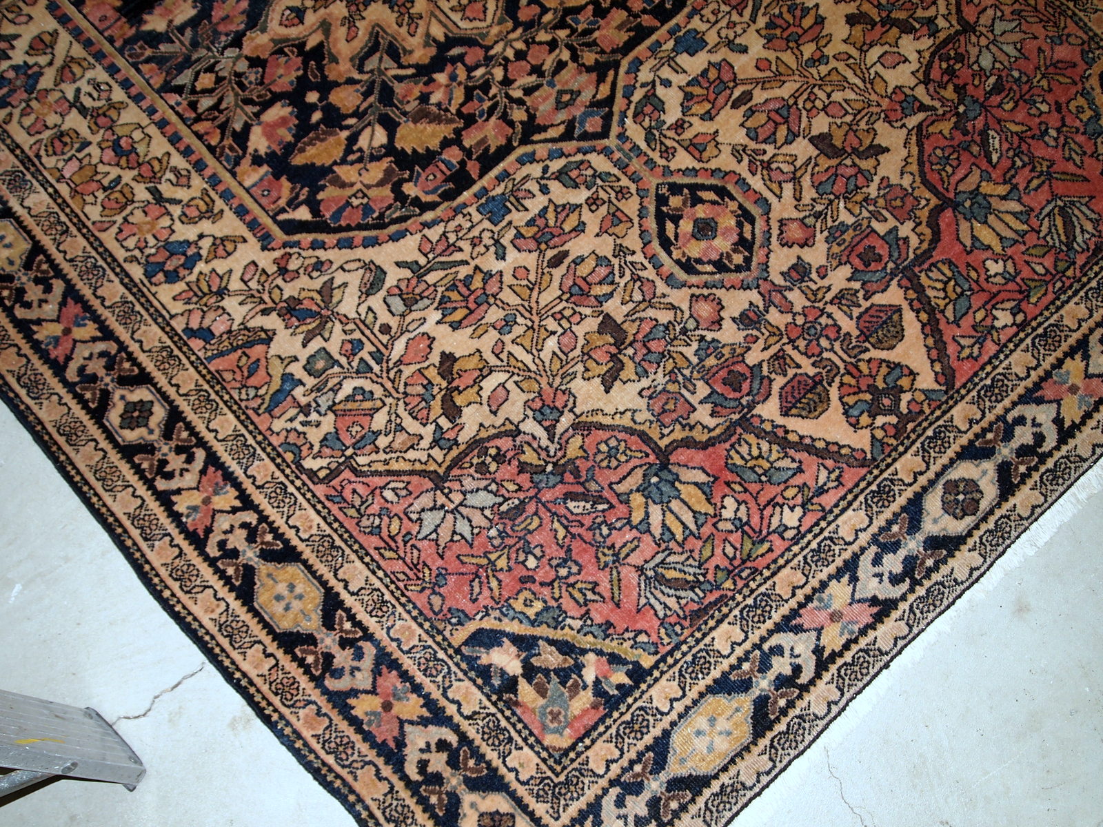 Handmade antique Sarouk Farahan rug in original good condition, has some low pile. The rug has been made in the beginning of 20th century.