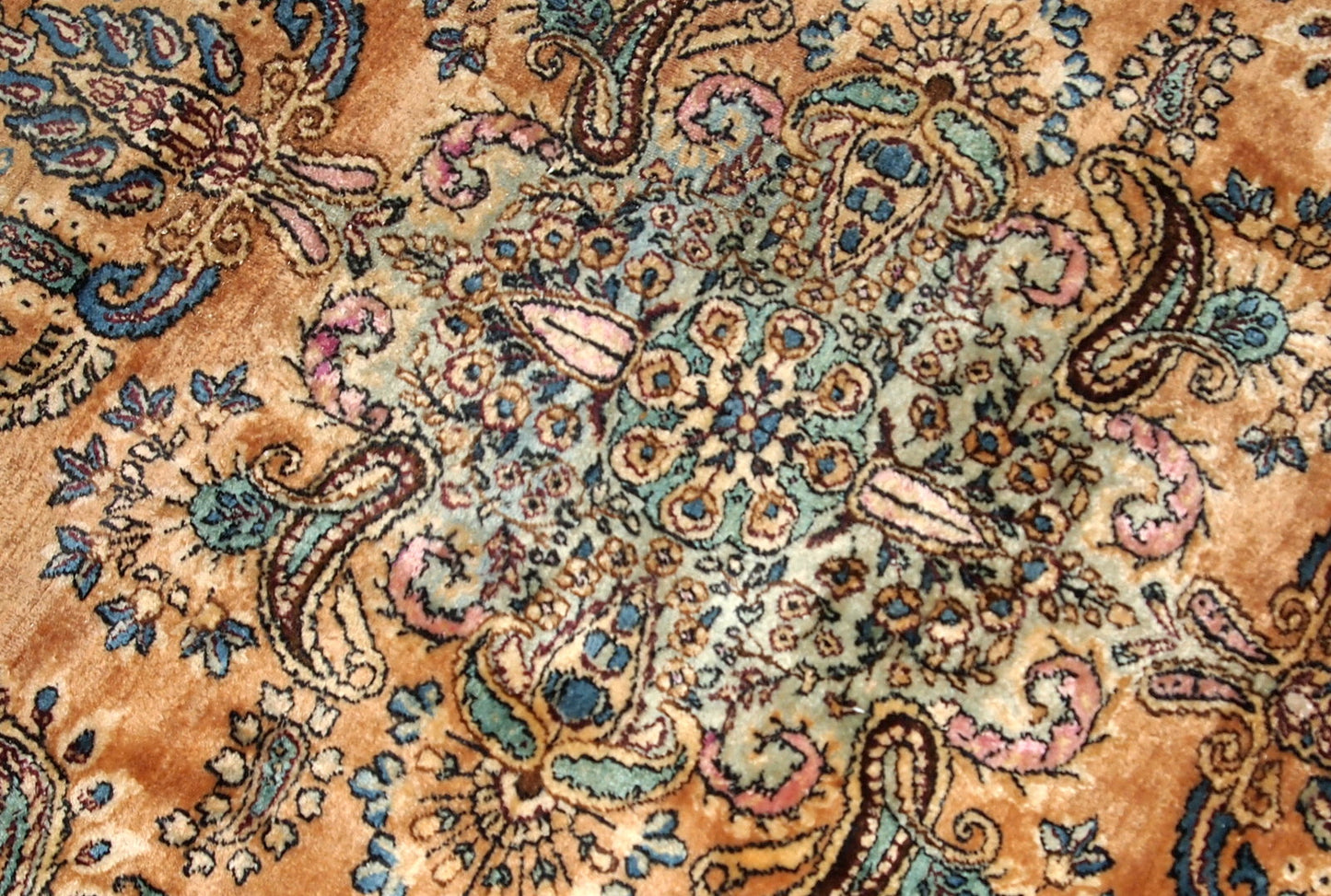 Antique hand-woven Kerman rug in original good condition. The rug is from the beginning of 20th century.