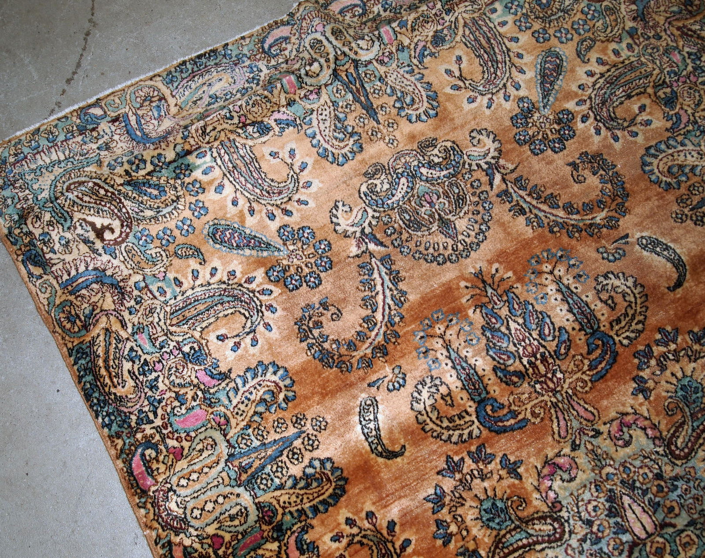 Antique hand-woven Kerman rug in original good condition. The rug is from the beginning of 20th century.