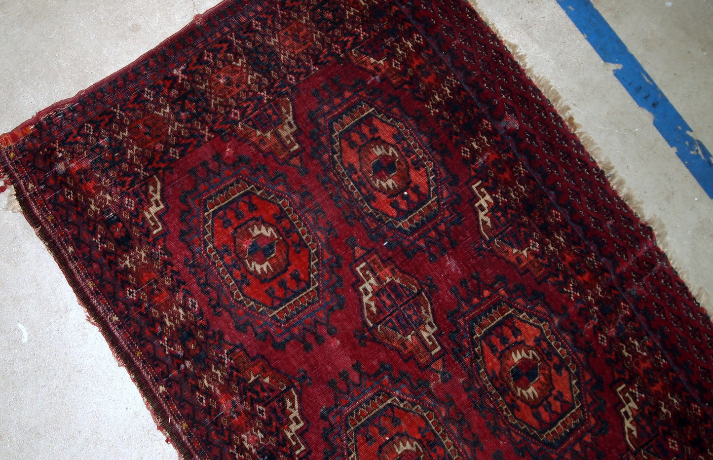 Handmade antique collectible Turkmen Saryk rug in scarlet shade. The rug is from the end of 19th century in original condition, it has some low pile and age wear.