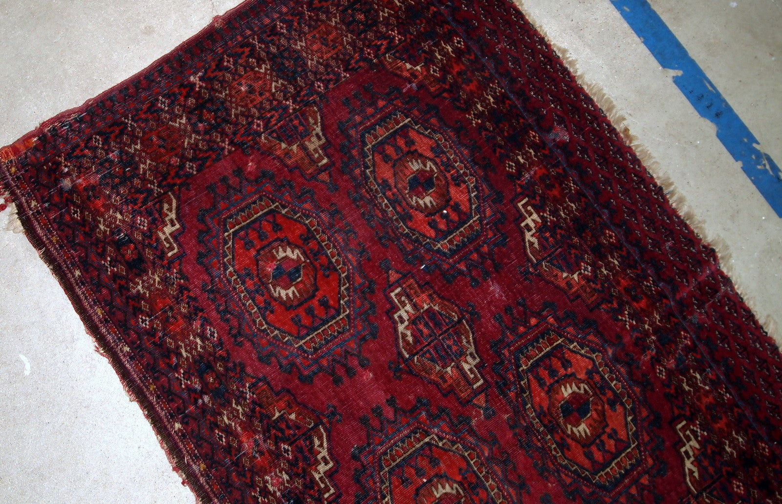 Handmade antique collectible Turkmen Saryk rug in scarlet shade. The rug is from the end of 19th century in original condition, it has some low pile and age wear.