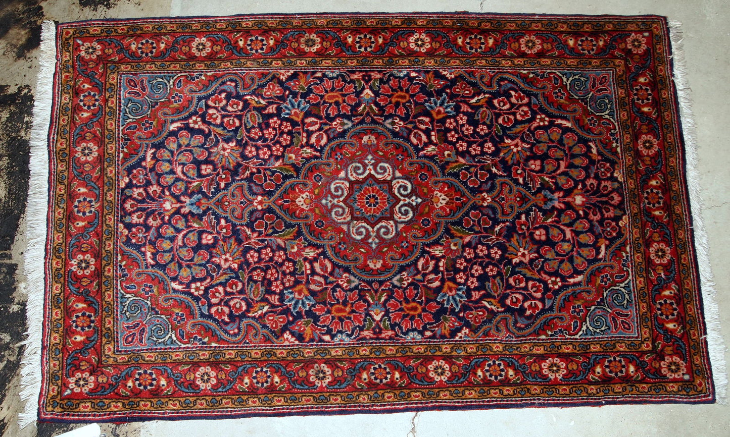 Handmade antique Persian Kazvin rug in original good condition. The rug is from the beginning of 20th century.