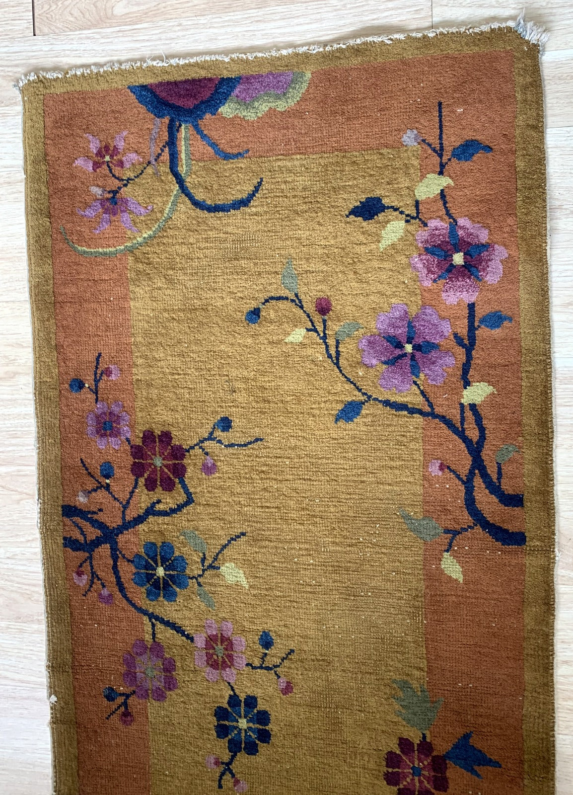 Handmade antique Art Deco Chinese rug in original good condition, it has some low pile. The rug is from the beginning of 20th century. 