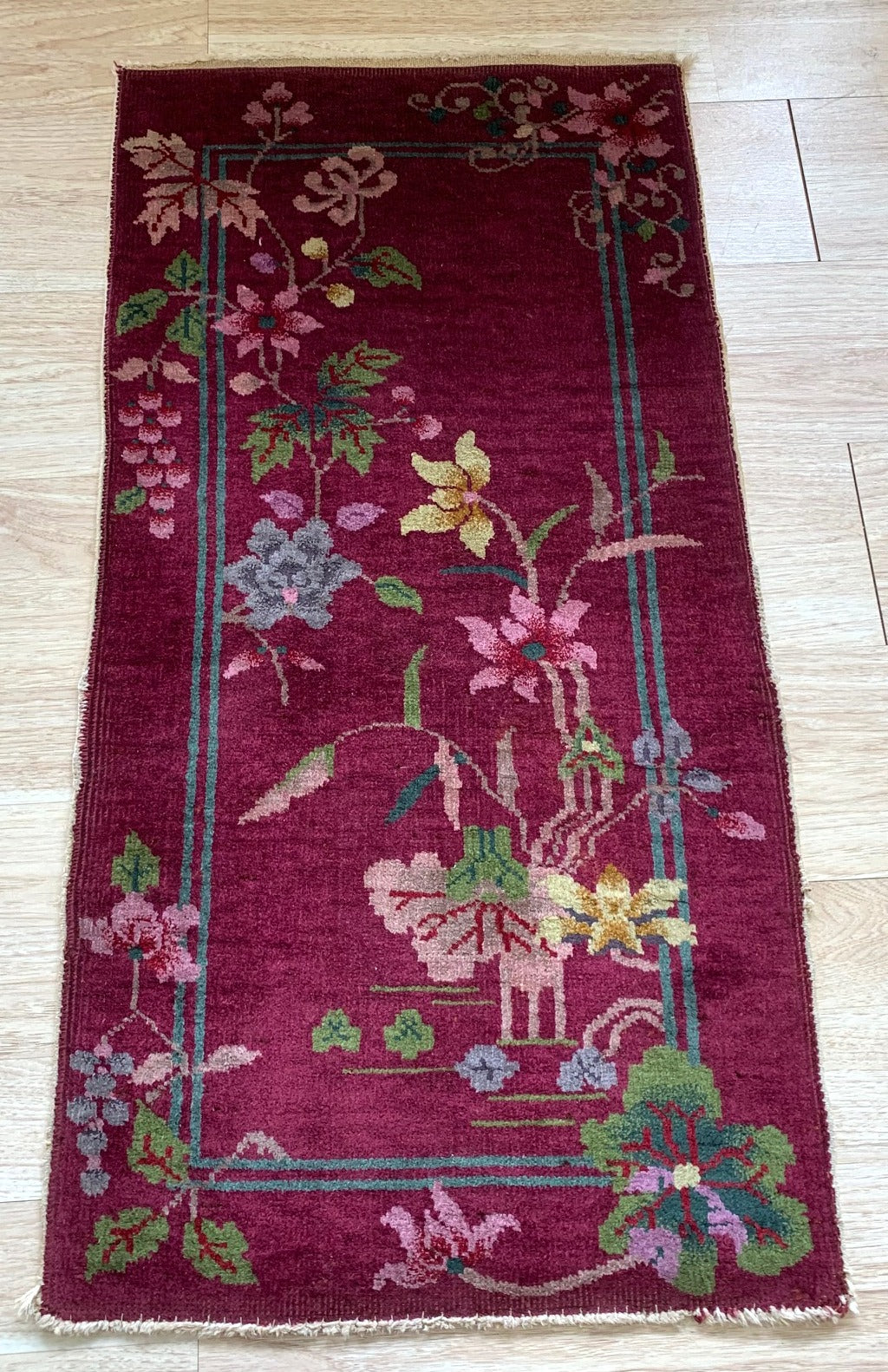 Handmade antique Art Deco Chinese rug in burgundy color. The rug is from the beginning of 20th century in original good condition.