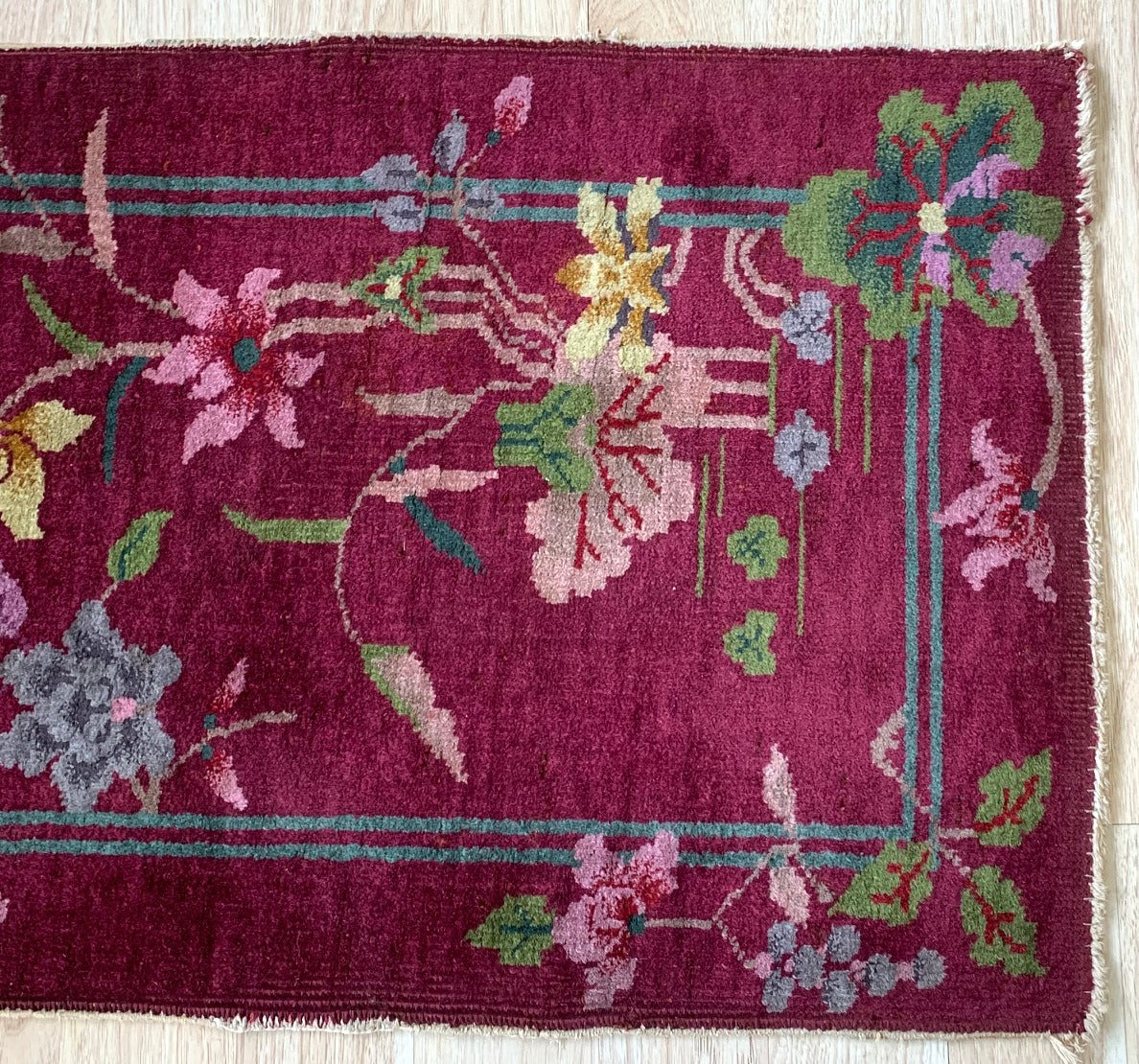 Handmade antique Art Deco Chinese rug in burgundy color. The rug is from the beginning of 20th century in original good condition.