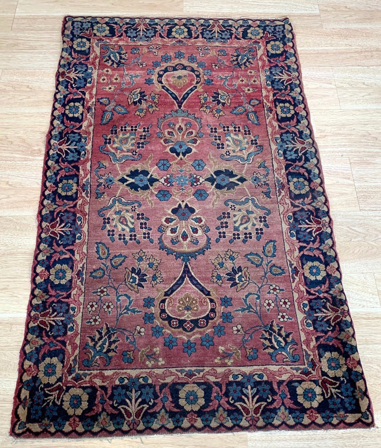 Handmade antique Middle Eastern rug in red and blue shades. The rug is from the beginning of 20th century in original good condition.