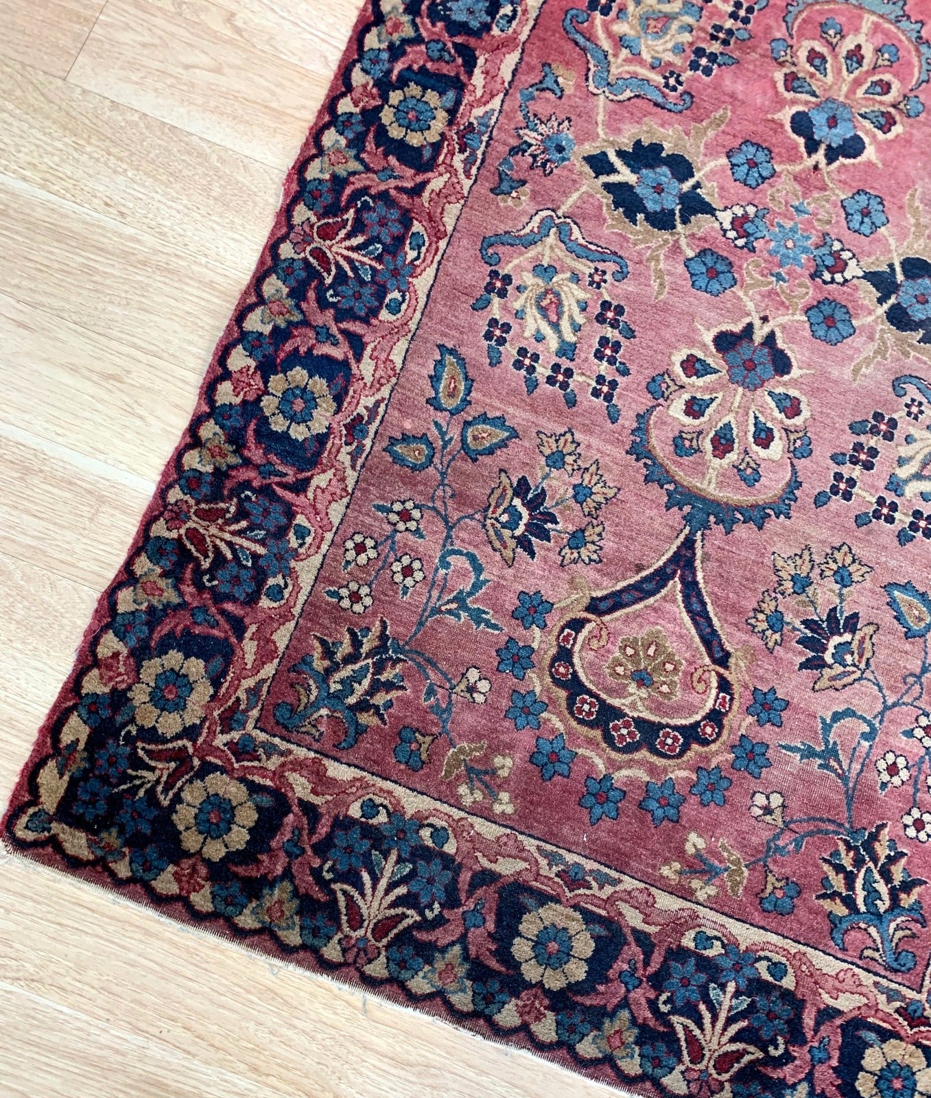 Handmade antique Middle Eastern rug in red and blue shades. The rug is from the beginning of 20th century in original good condition.