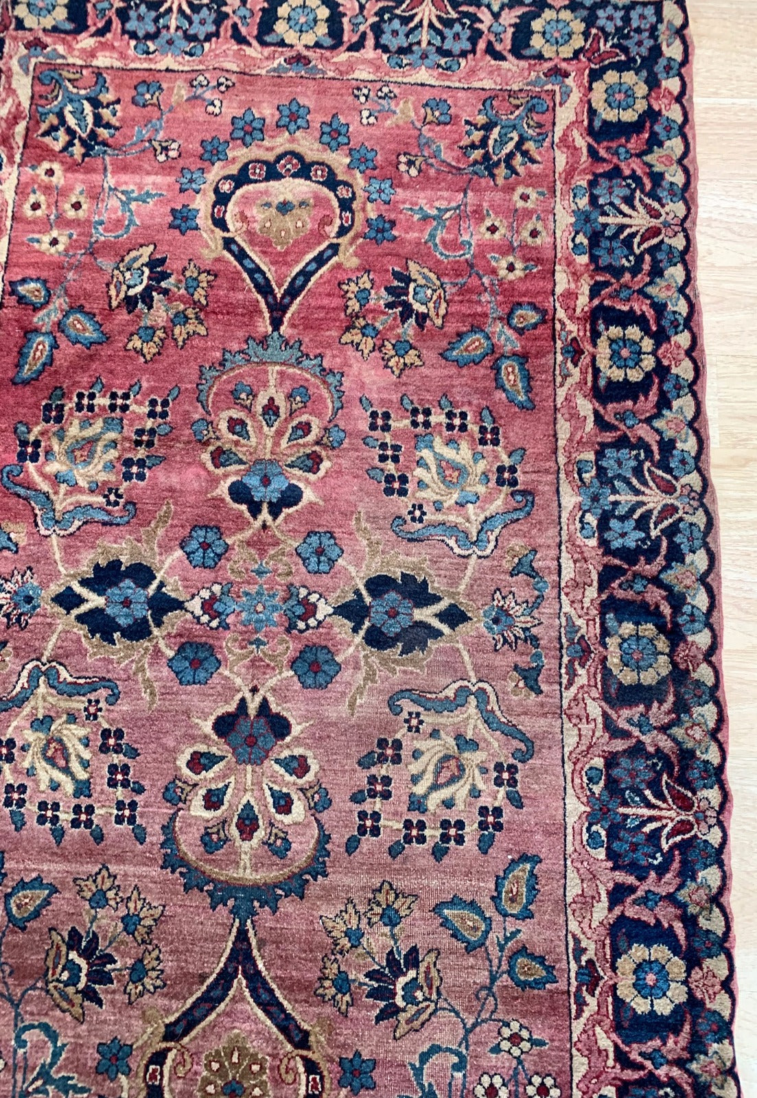Handmade antique Middle Eastern rug in red and blue shades. The rug is from the beginning of 20th century in original good condition.
