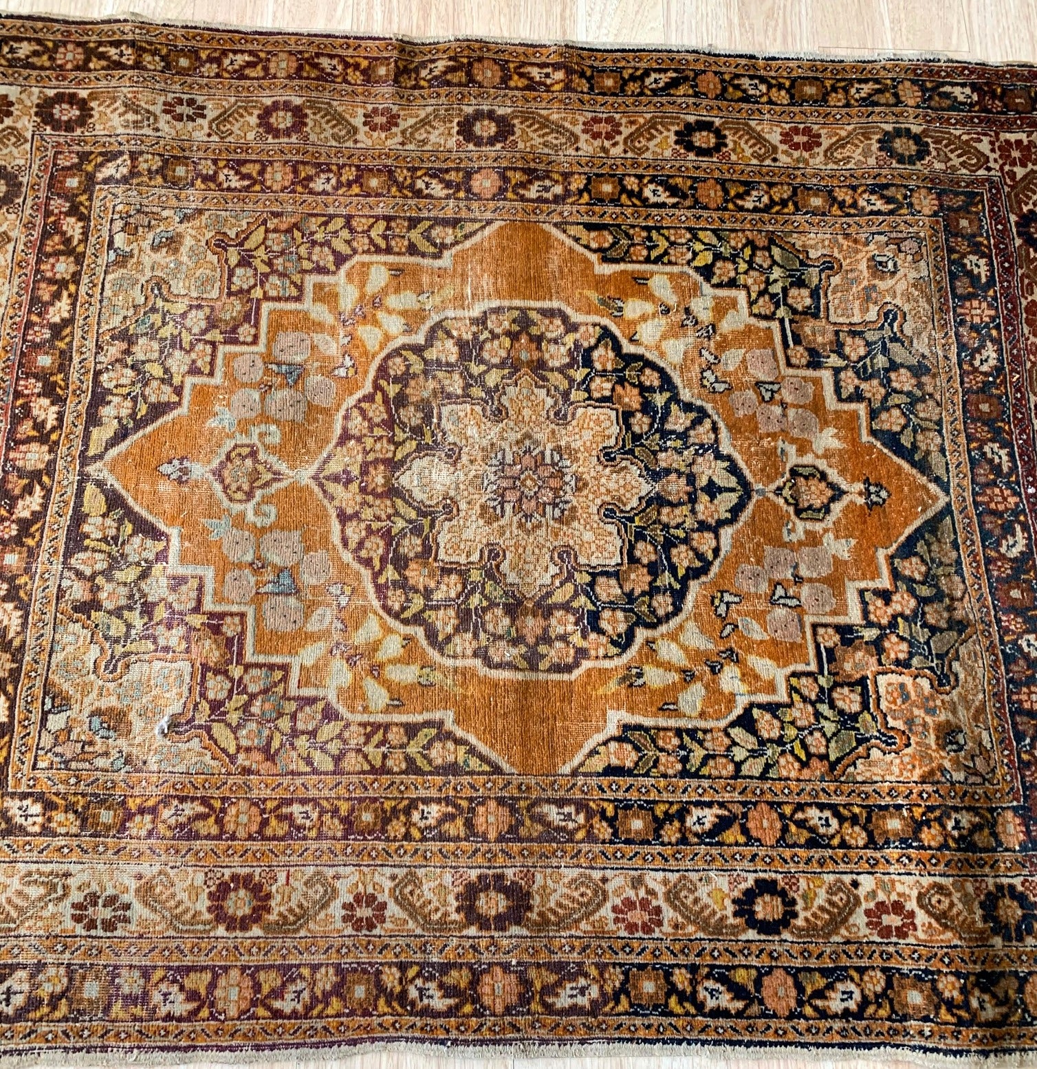 Handmade antique Middle Eastern rug in natural dyes. The rug is from the end of 19th century in original condition, it has some signs of age.