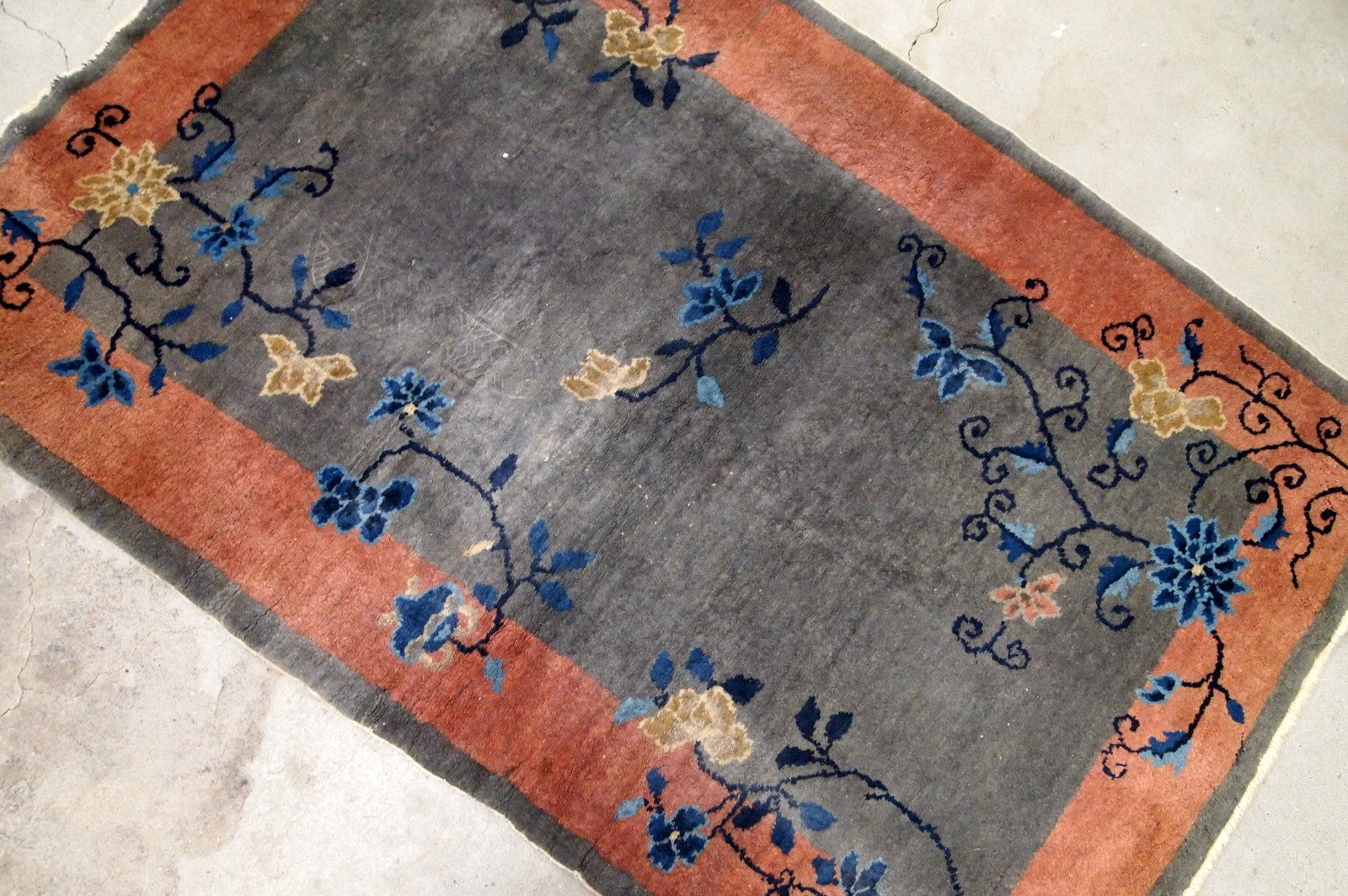 Handmade antique Art Deco Chinese rug in red and grey shades. The rug is from the beginning of 20th century in original good condition.