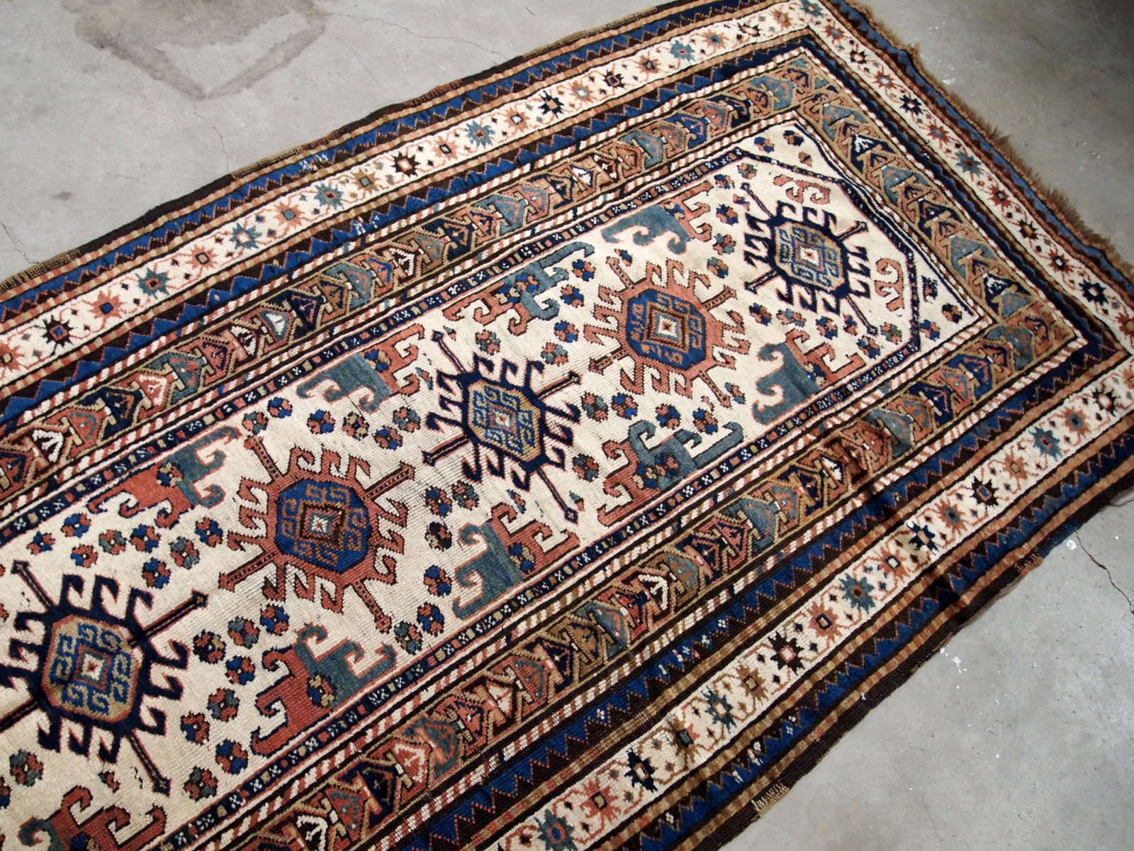 Handmade antique Caucasian Kazak rug in kele size. The rug is from the end of 19th century in original good condition.