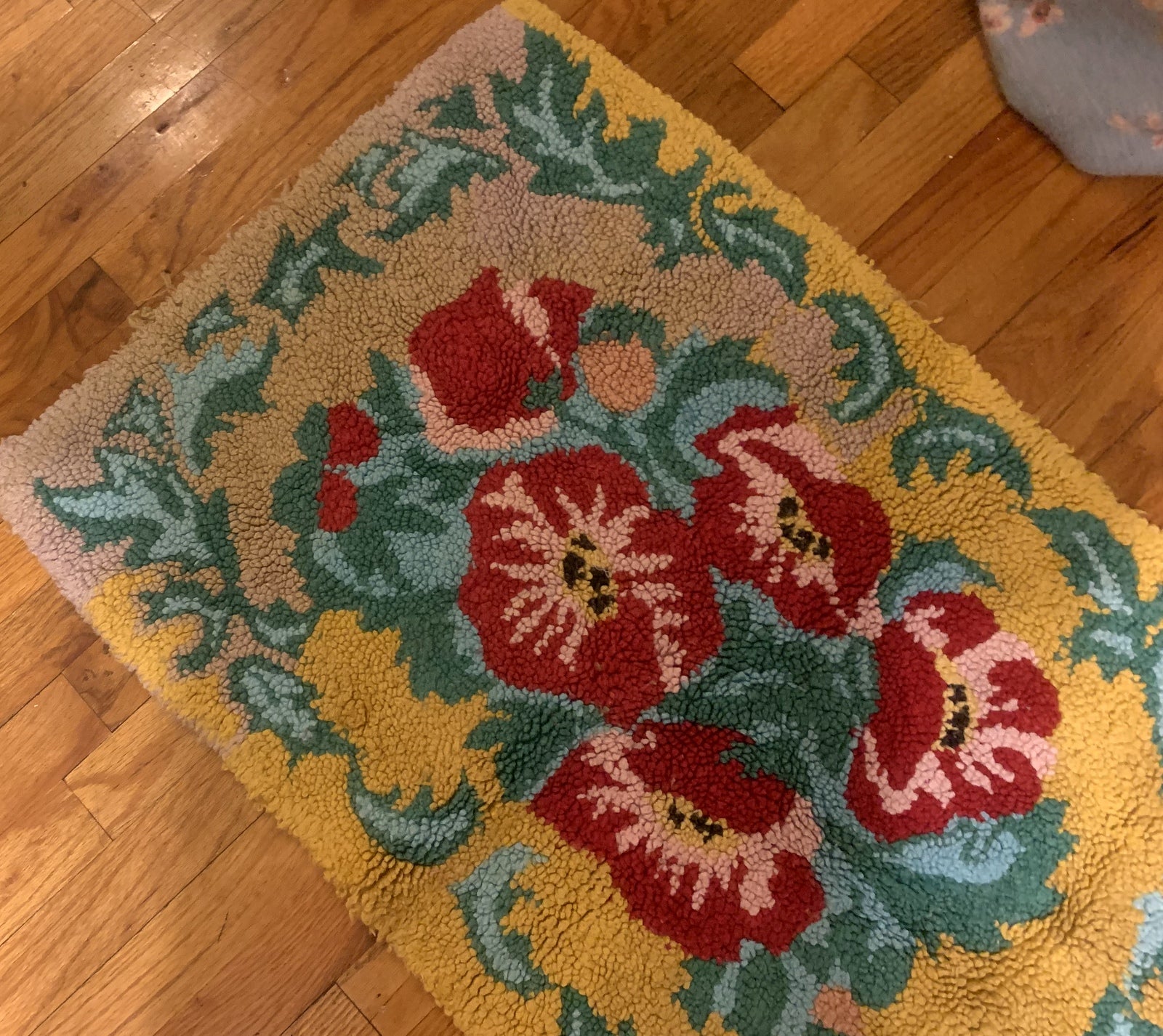 Handmade vintage American Hooked rug in floral design and yellow shade. The rug is from the middle of 20th century in original good condition. 