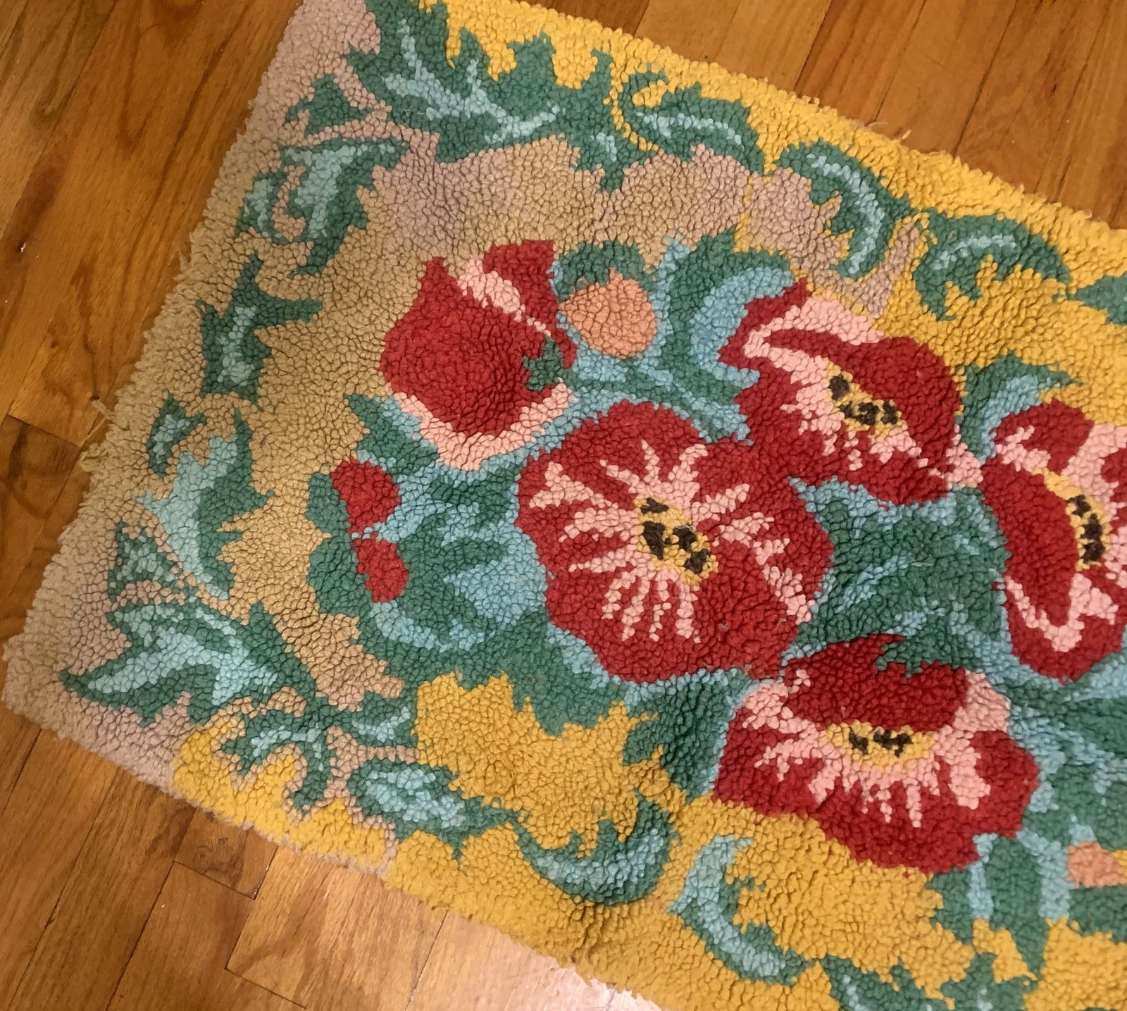 Handmade vintage American Hooked rug in floral design and yellow shade. The rug is from the middle of 20th century in original good condition. 