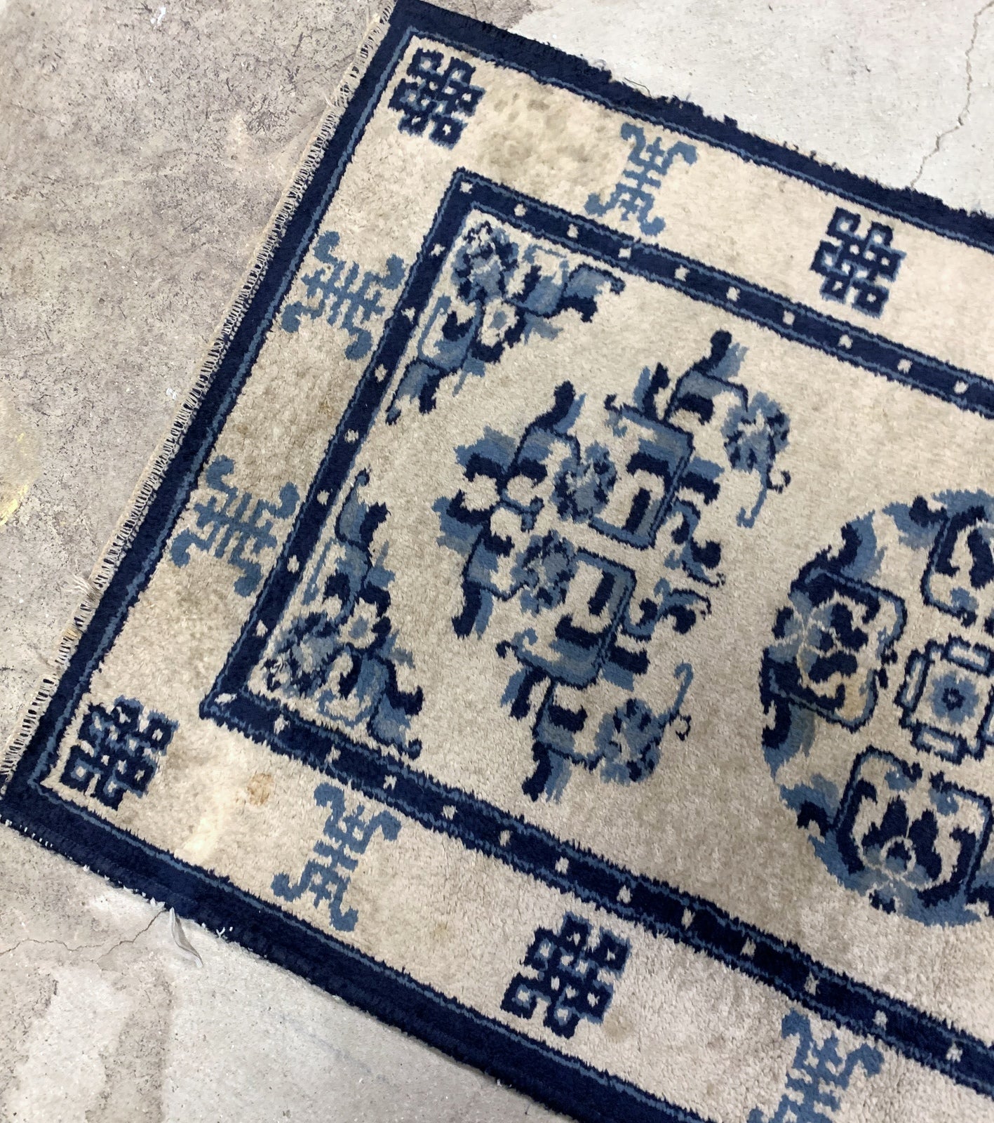 Handmade antique Peking Chinese rug in beige and blue colors. The rug is from the beginning of 20th century in original good condition.