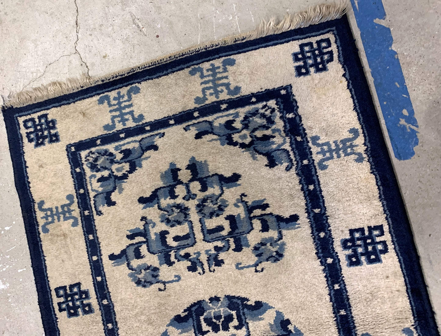 Handmade antique Peking Chinese rug in beige and blue colors. The rug is from the beginning of 20th century in original good condition.