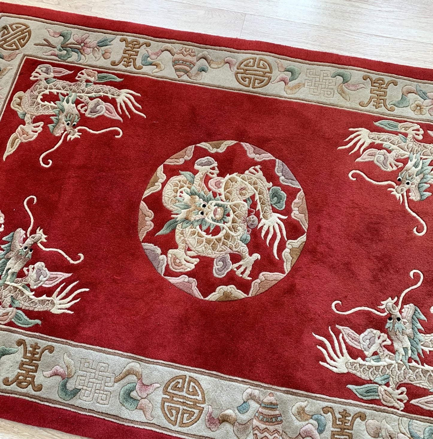 Handmade vintage Art Deco Chinese rug in bright red color and dragon design. The rug is from the middle of 20th century in original good condition. 