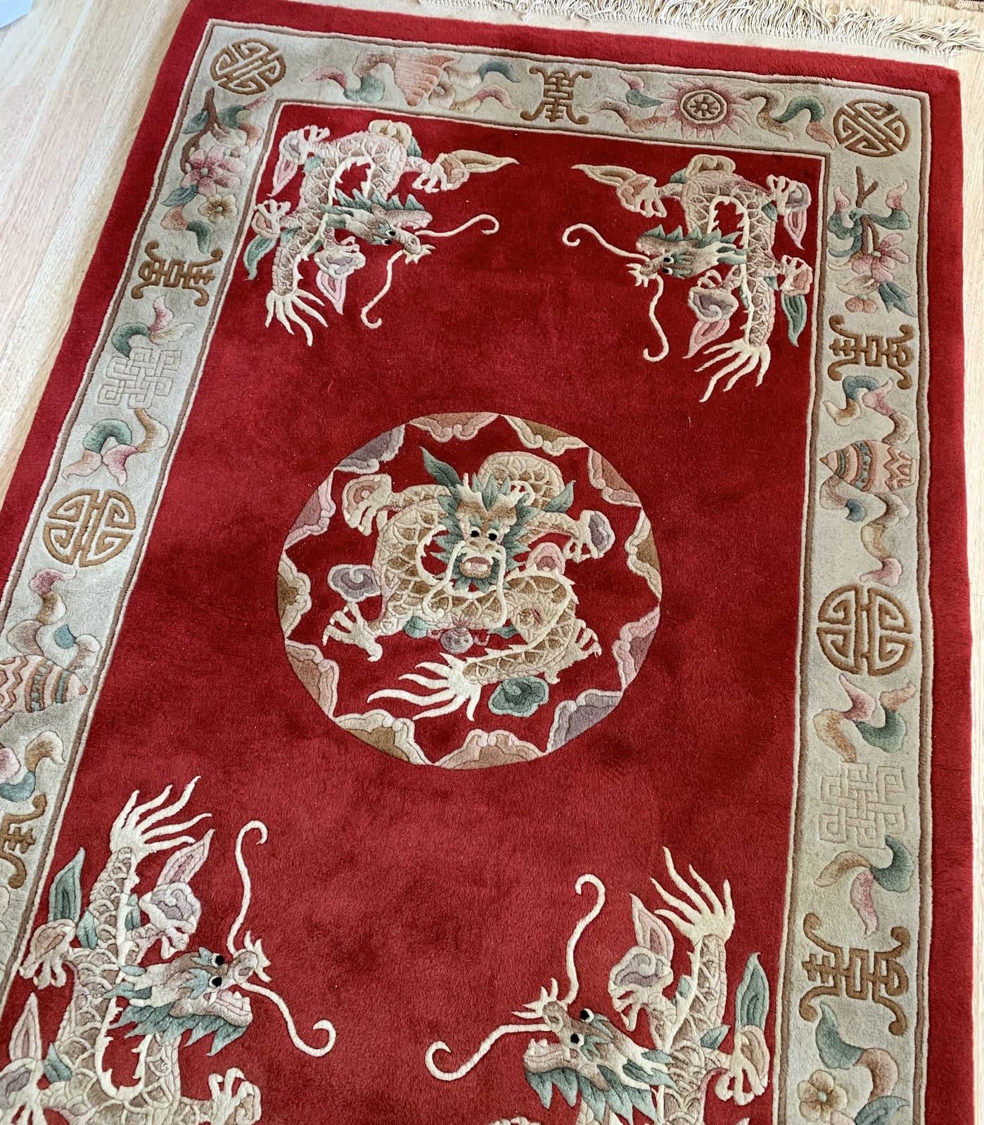 Handmade vintage Art Deco Chinese rug in bright red color and dragon design. The rug is from the middle of 20th century in original good condition. 