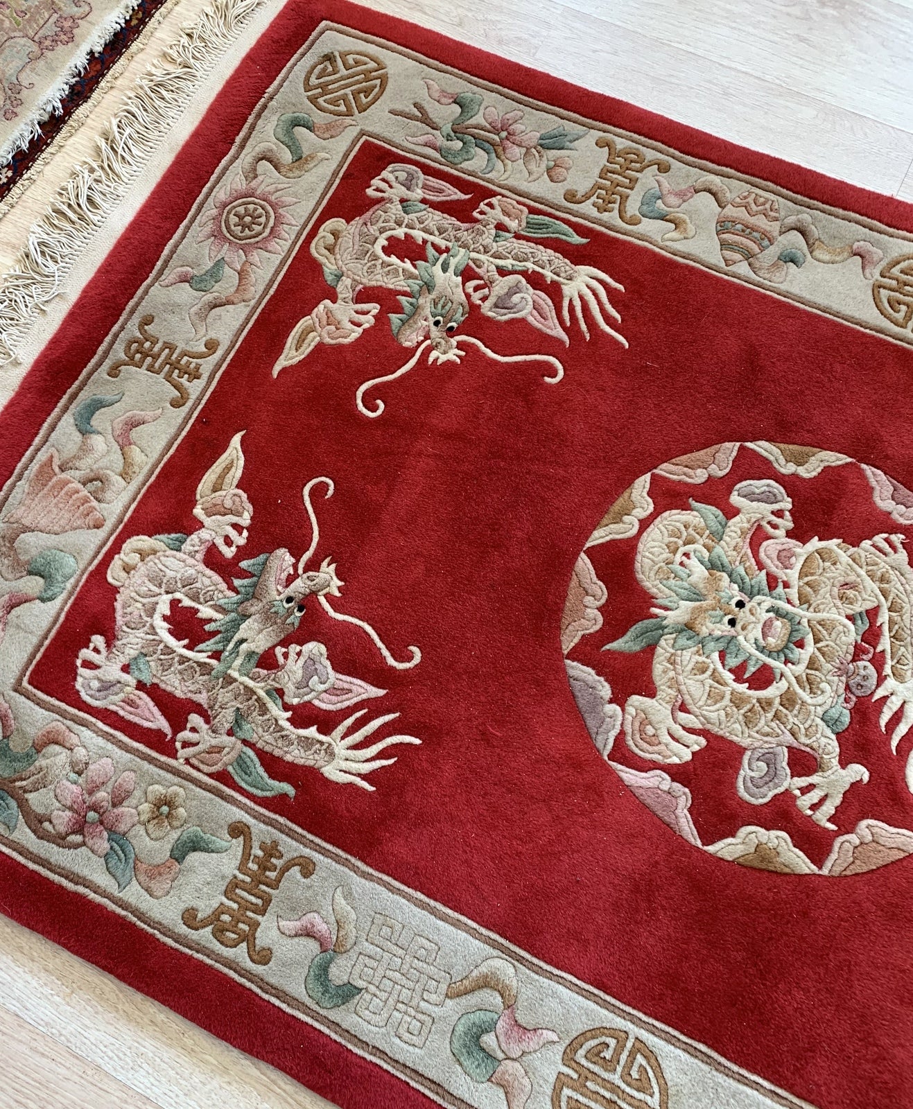 Handmade vintage Art Deco Chinese rug in bright red color and dragon design. The rug is from the middle of 20th century in original good condition. 