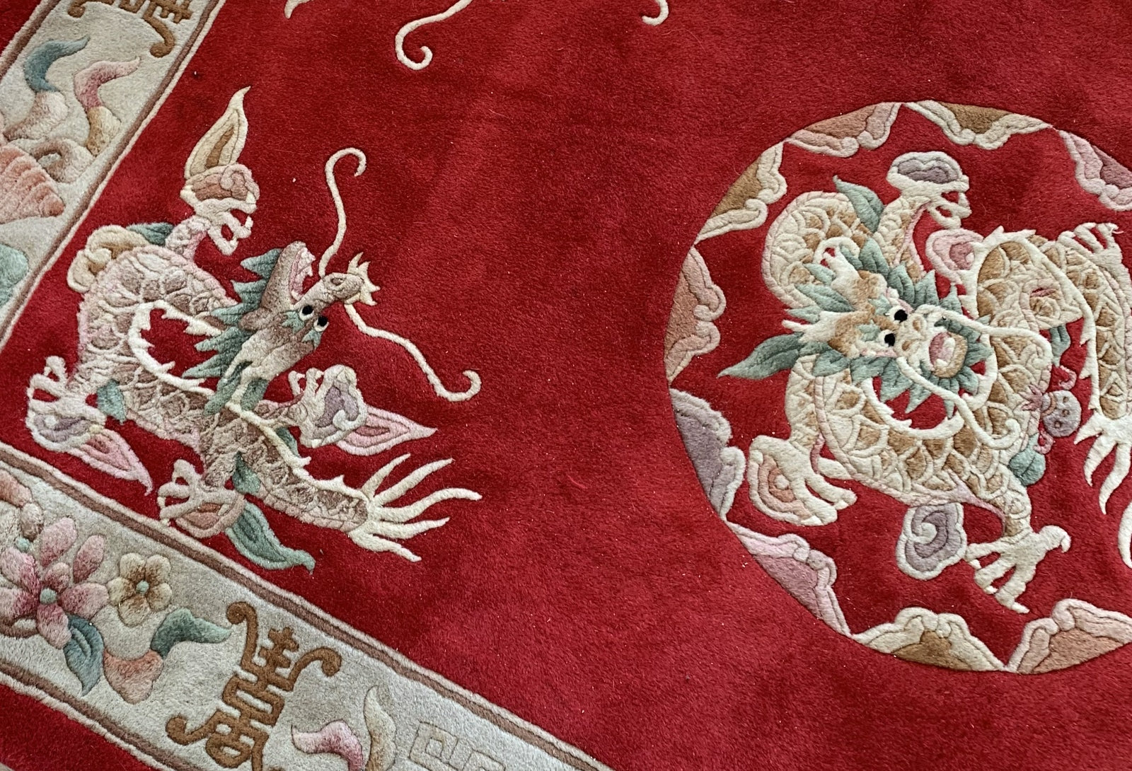 Handmade vintage Art Deco Chinese rug in bright red color and dragon design. The rug is from the middle of 20th century in original good condition. 