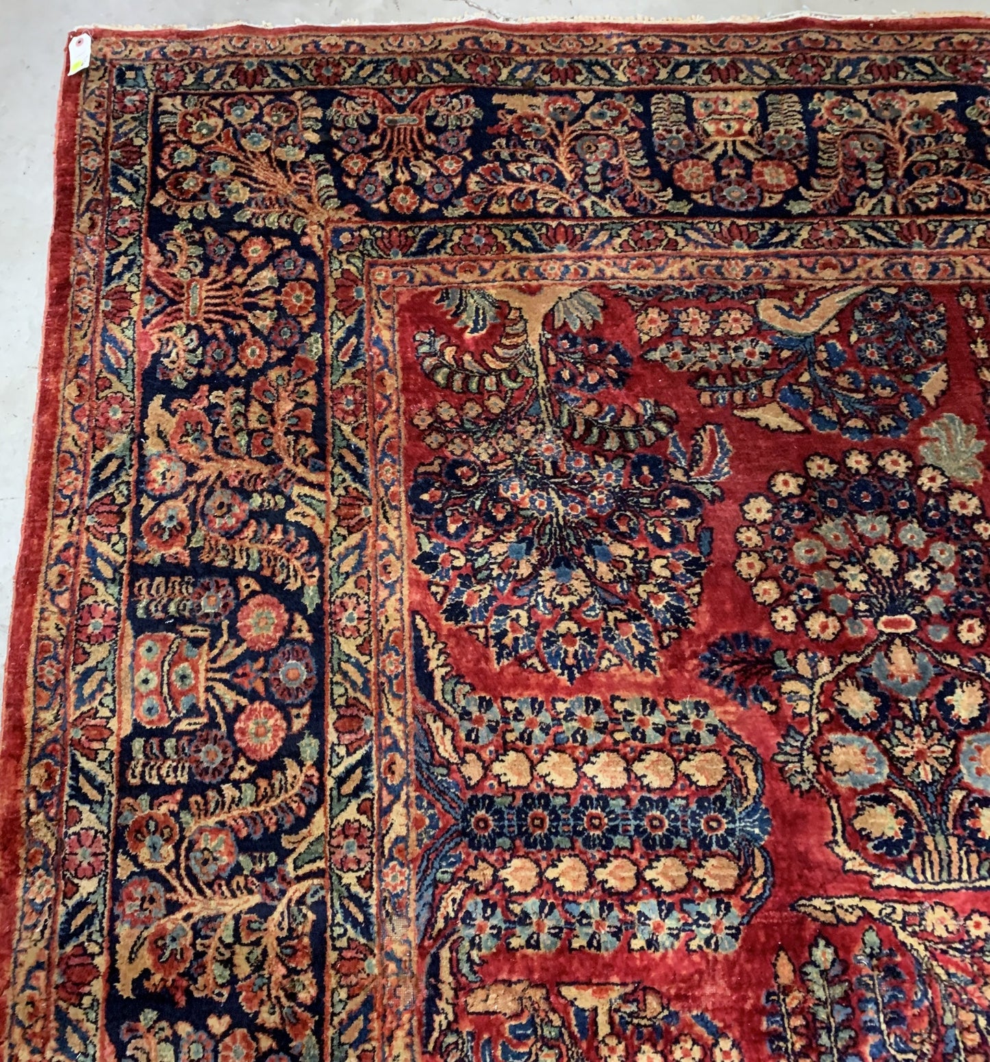 Handmade antique Muiddle Eastern rug in traditional floral design. The rug is from the beginning of 20th century in original good condition.