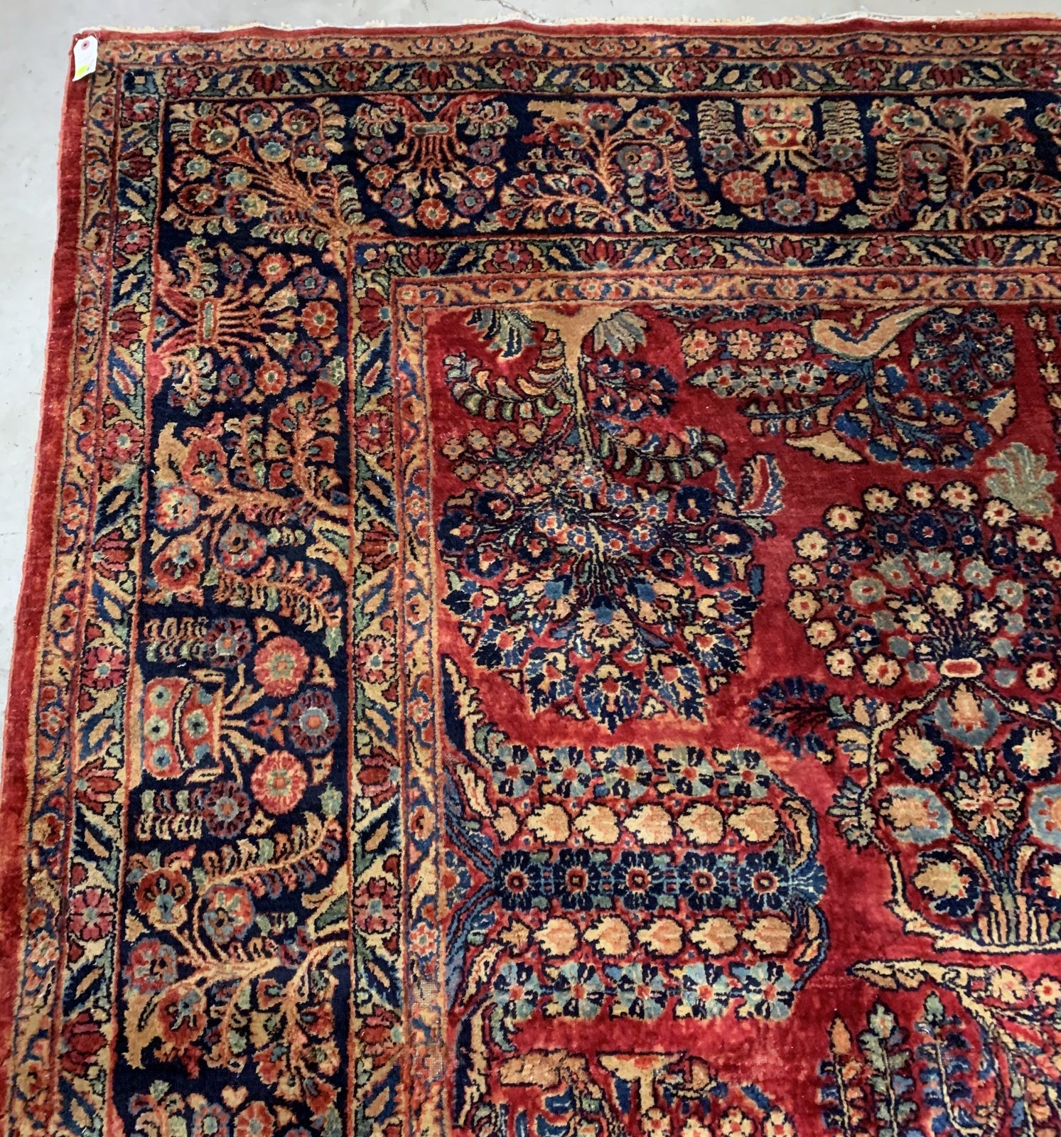 Handmade antique Muiddle Eastern rug in traditional floral design. The rug is from the beginning of 20th century in original good condition.