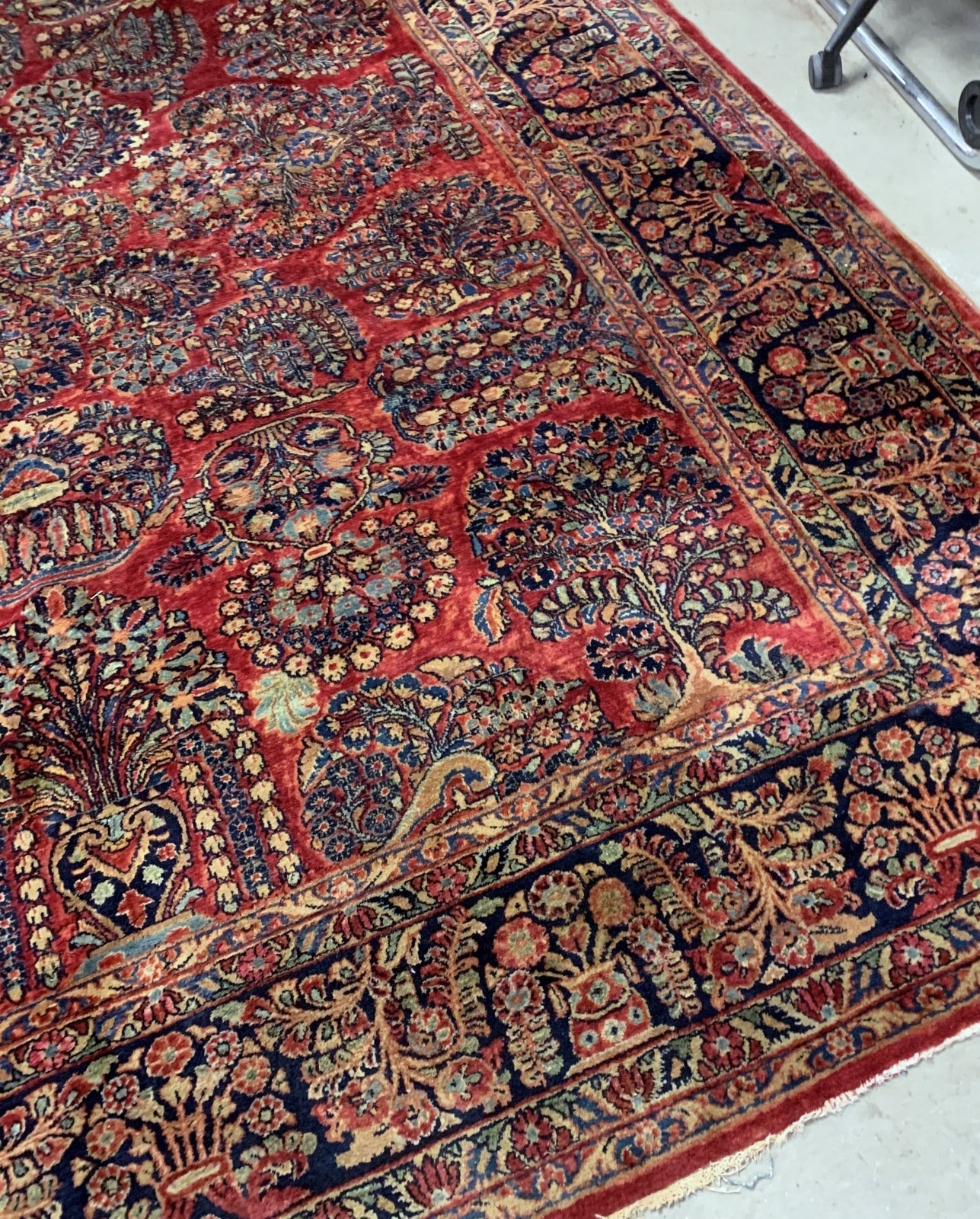 Handmade antique Muiddle Eastern rug in traditional floral design. The rug is from the beginning of 20th century in original good condition.