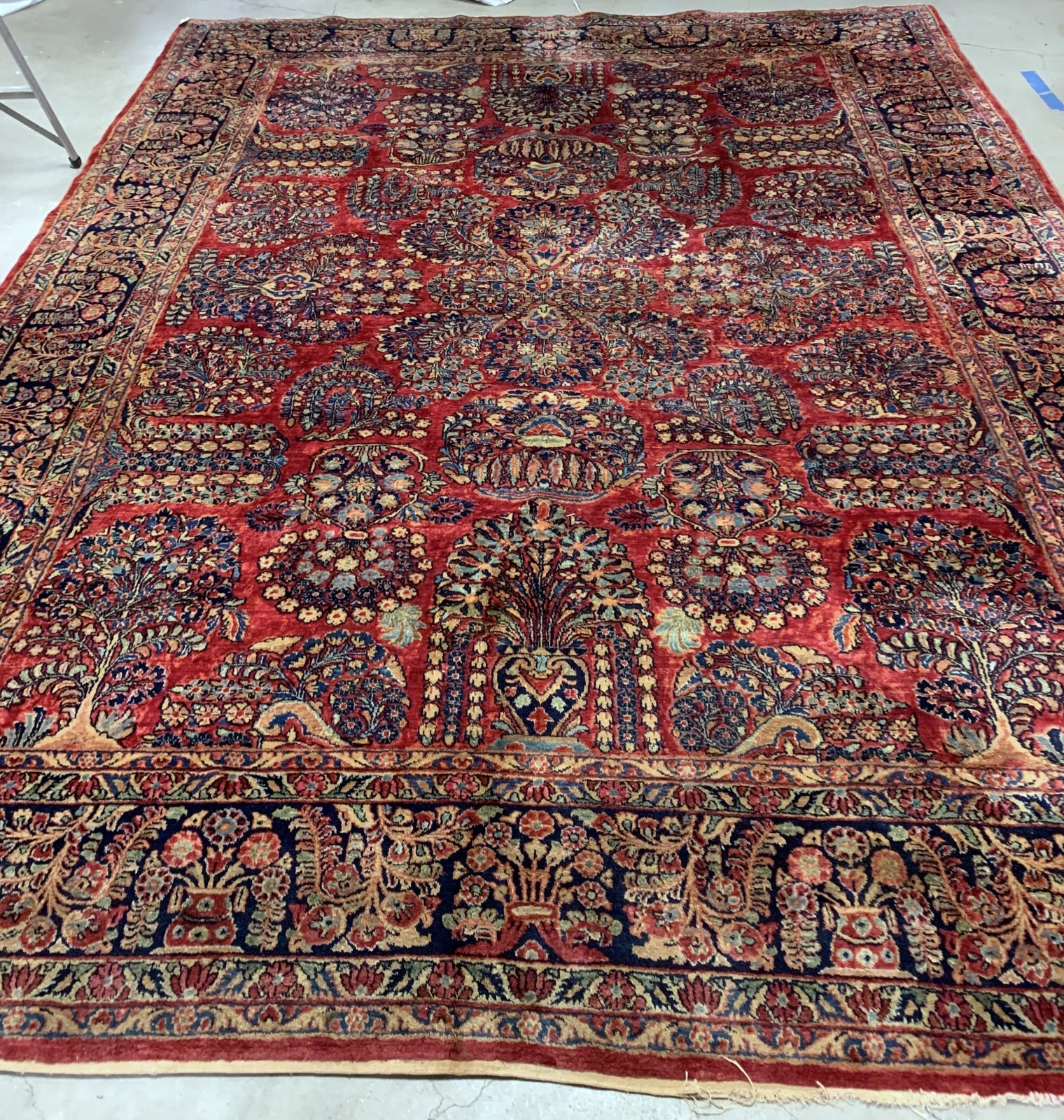 Handmade antique Muiddle Eastern rug in traditional floral design. The rug is from the beginning of 20th century in original good condition.
